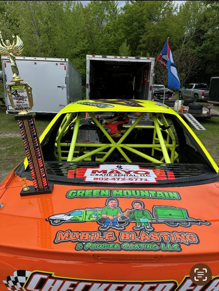 Jamie Davis Racing season opener trophy beside Green Mountain Mobile Sandblasting and Powder Coating logo