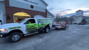 "GM Powder Coating parade truck pulling sleigh at Johnson VT Holiday Jubilee with Mrs. Claus Gigi Beach"