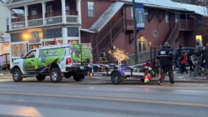 GM Powder Coating parade truck pulling sleigh at Johnson VT Holiday Jubilee with Mrs. Claus Gigi Beach