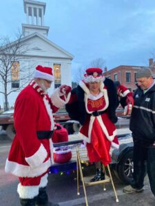 GM Powder Coating parade truck pulling sleigh at Johnson VT Holiday Jubilee with Mrs. Claus Gigi Beach