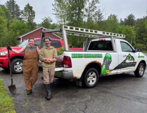 Community volunteers planting garden beds in the rain at Johnson Elementary School in Vermont