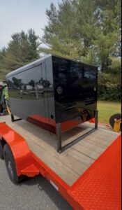 375 CFM mobile dry sandblasting trailer transformed from tan to branded rolling billboard by GM Powder Coating