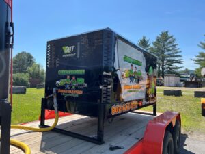 375 CFM mobile dry sandblasting trailer transformed from tan to branded rolling billboard by GM Powder Coating