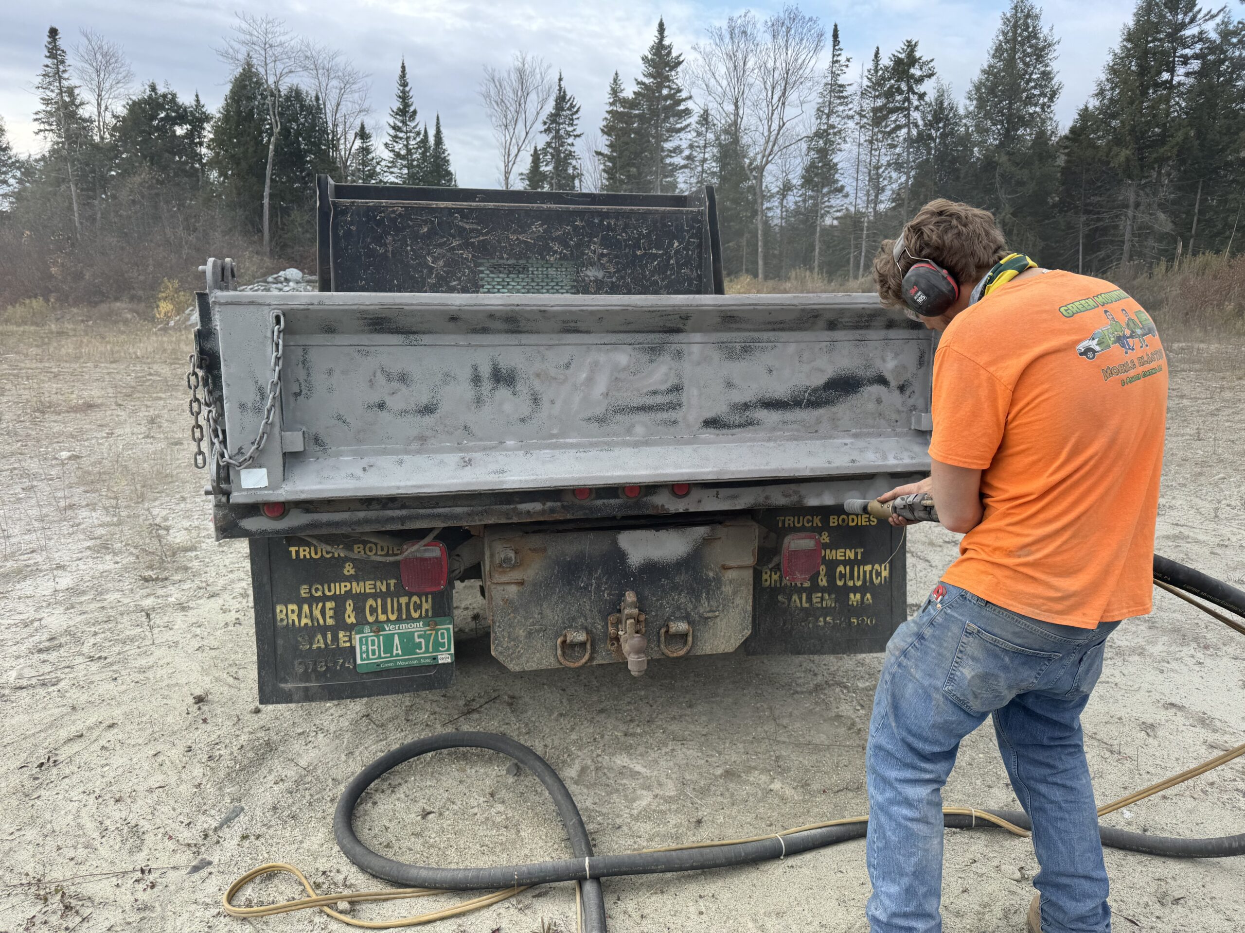 Dump Truck Bed Sandblasting – Pit Day 2025 in Eden Vermont Dump truck bed sandblasting during Pit Day 2025 by Green Mountain Mobile Sandblasting and Powder Coating