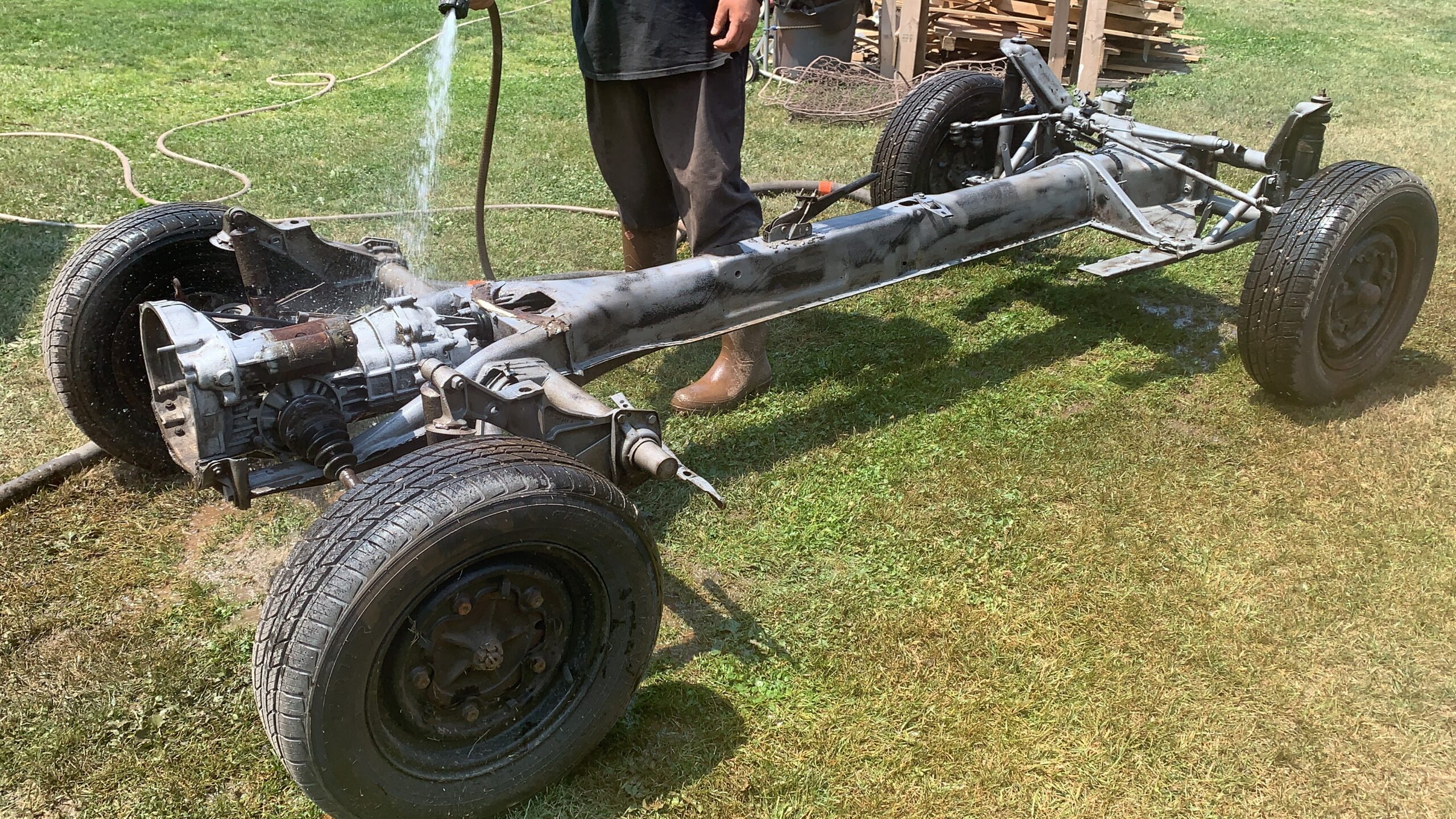 VW Bus Frame – Wet Sandblasting in Progress VW bus frame being wet sandblasted by Green Mountain Mobile Sandblasting and Powder Coating