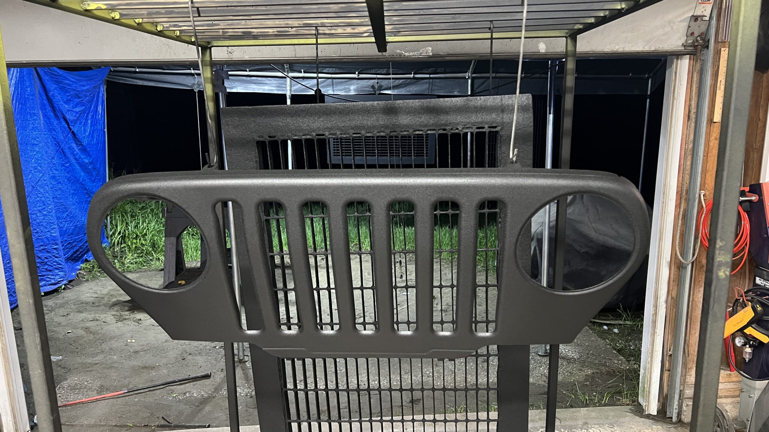 Raptor Bedliner – Jeep Grille & Storm Grate Coatings Jeep grille and storm grates coated with Raptor bedliner by Green Mountain Mobile Sandblasting and Powder Coating