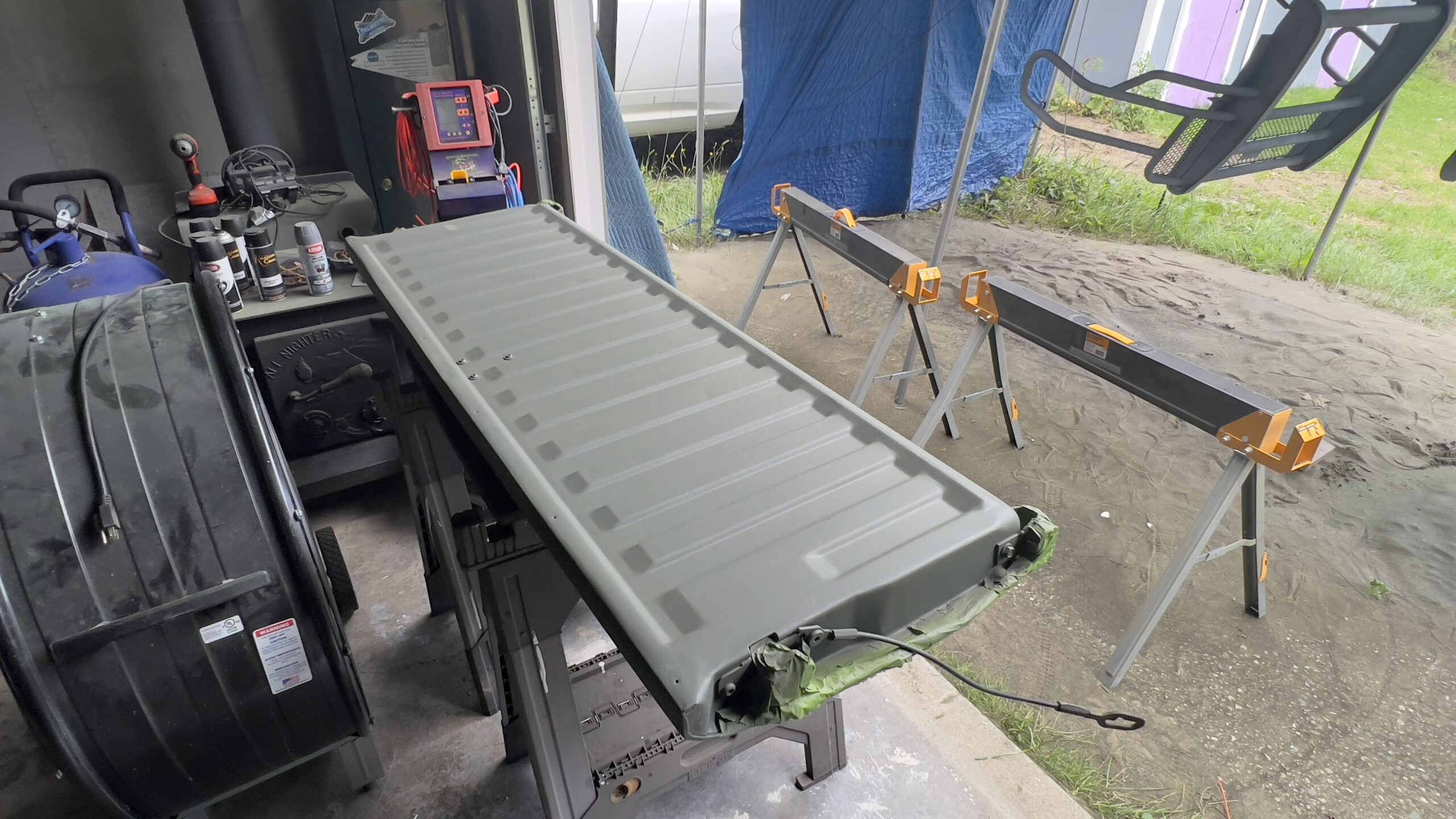 Tailgate Restoration – Sandblasted and White Bedliner Coated Rusty tailgate sandblasted and coated with white bedliner by Green Mountain Mobile Sandblasting and Powder Coating