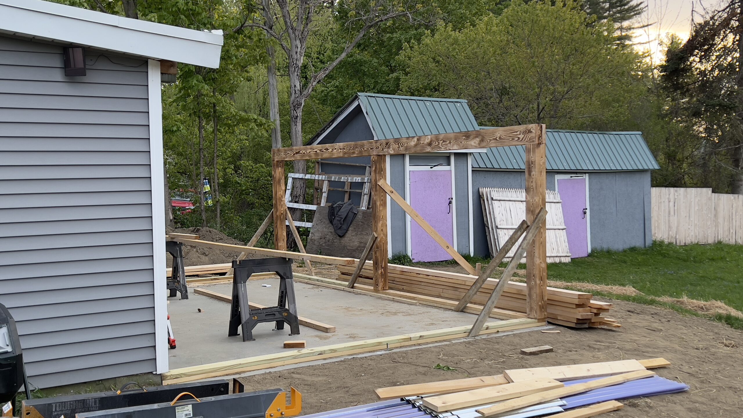 Powder Coating Shop Expansion – Build-On Addition Project Build-on addition behind powder coating shop by Green Mountain Mobile Sandblasting and Powder Coating replacing former sandblasting carport