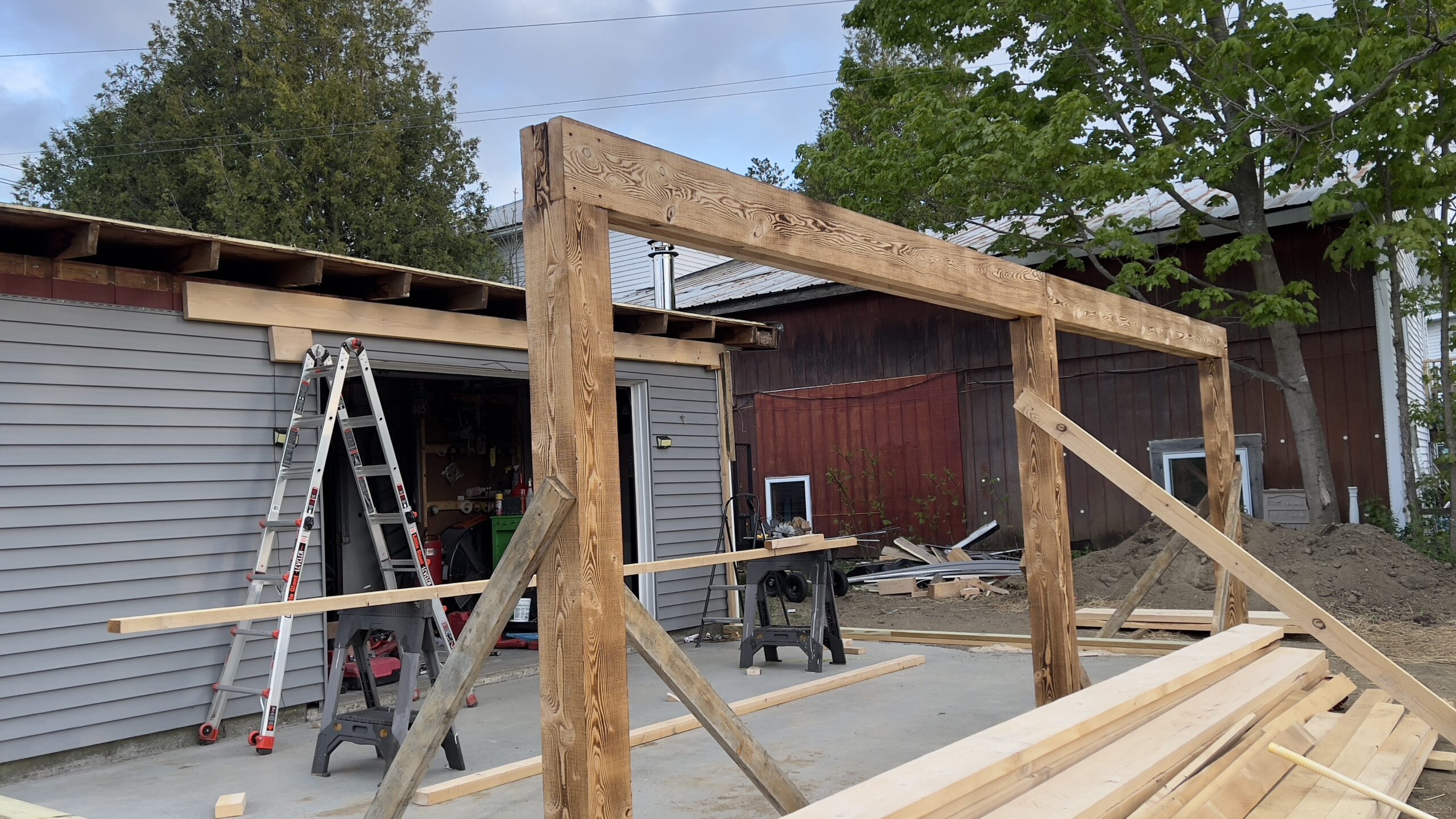 Powder Coating Shop Expansion – Build-On Addition Project Build-on addition behind powder coating shop by Green Mountain Mobile Sandblasting and Powder Coating replacing former sandblasting carport