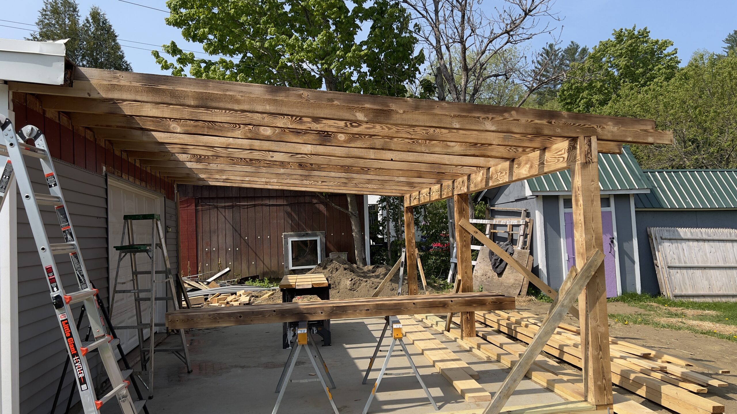 Powder Coating Shop Expansion – Build-On Addition Project Build-on addition behind powder coating shop by Green Mountain Mobile Sandblasting and Powder Coating replacing former sandblasting carport