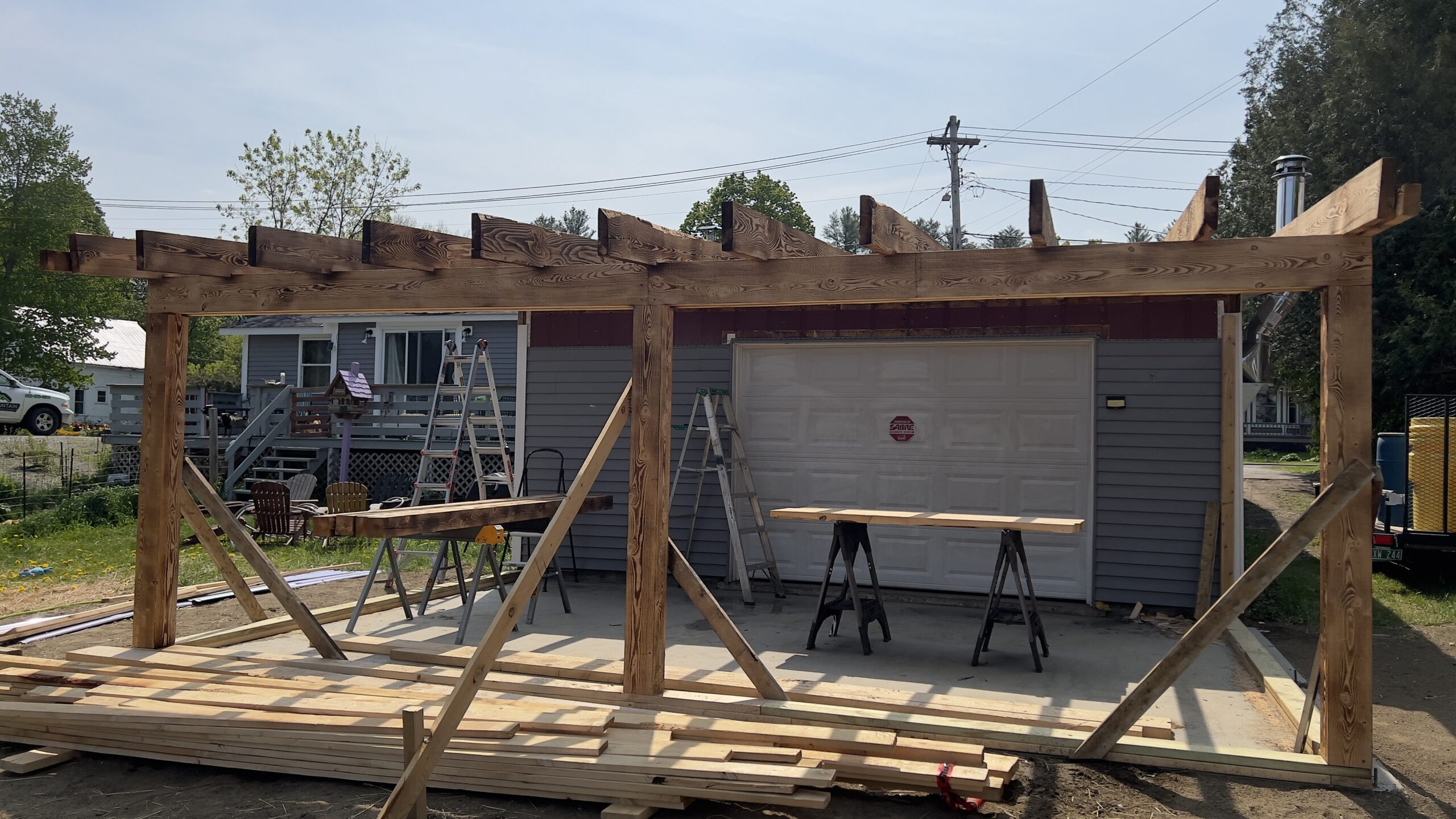 Powder Coating Shop Expansion – Build-On Addition Project Build-on addition behind powder coating shop by Green Mountain Mobile Sandblasting and Powder Coating replacing former sandblasting carport
