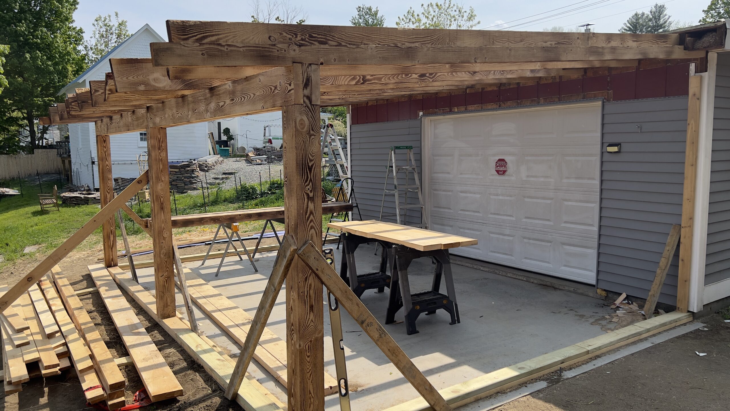 Powder Coating Shop Expansion – Build-On Addition Project Build-on addition behind powder coating shop by Green Mountain Mobile Sandblasting and Powder Coating replacing former sandblasting carport
