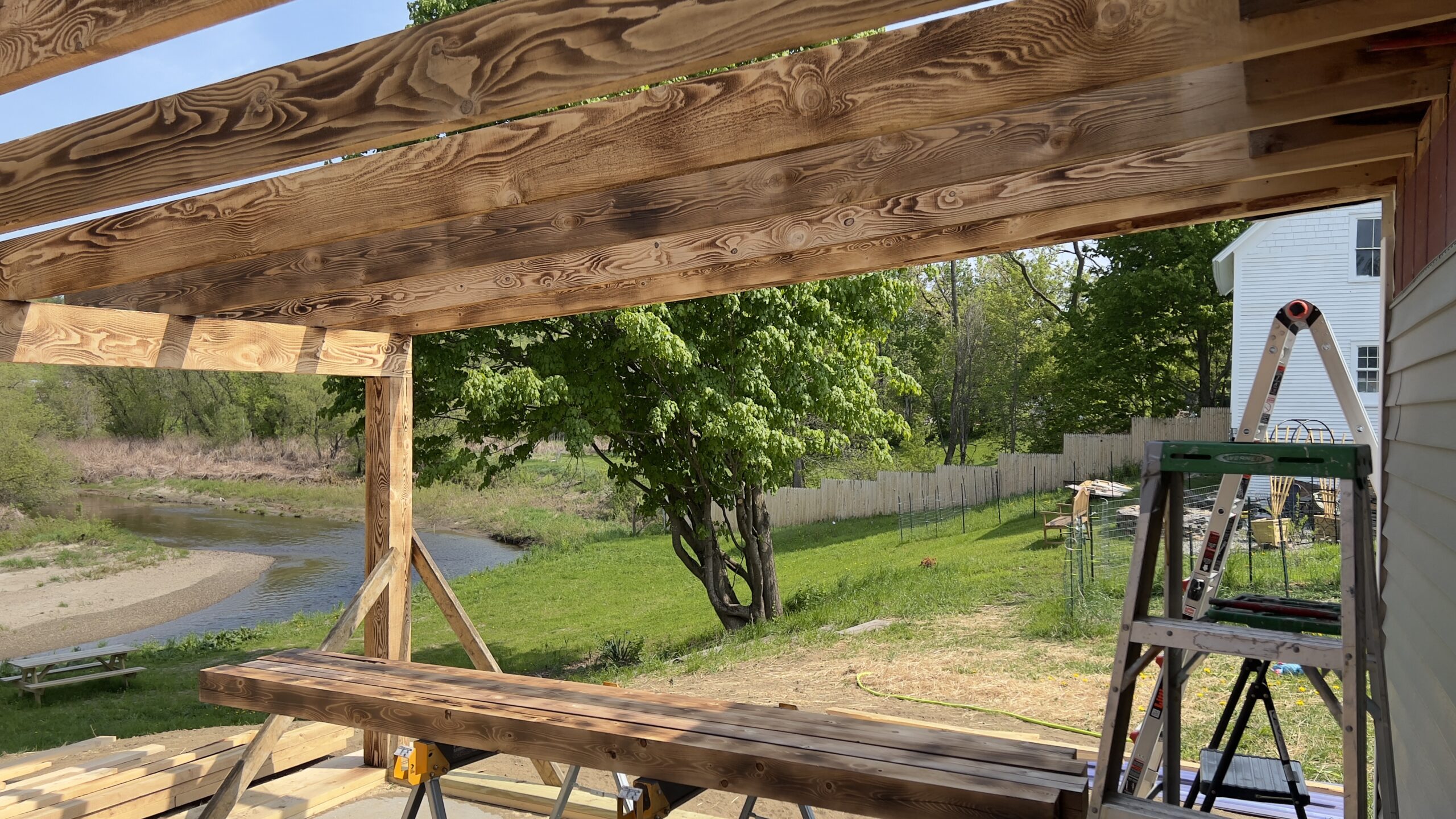 Powder Coating Shop Expansion – Build-On Addition Project Build-on addition behind powder coating shop by Green Mountain Mobile Sandblasting and Powder Coating replacing former sandblasting carport