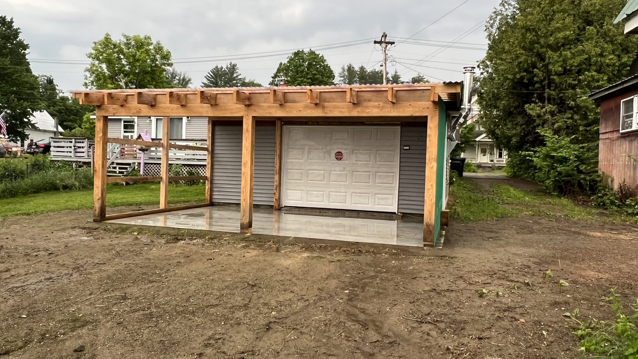 Powder Coating Shop Expansion – Build-On Addition Project Build-on addition behind powder coating shop by Green Mountain Mobile Sandblasting and Powder Coating replacing former sandblasting carport