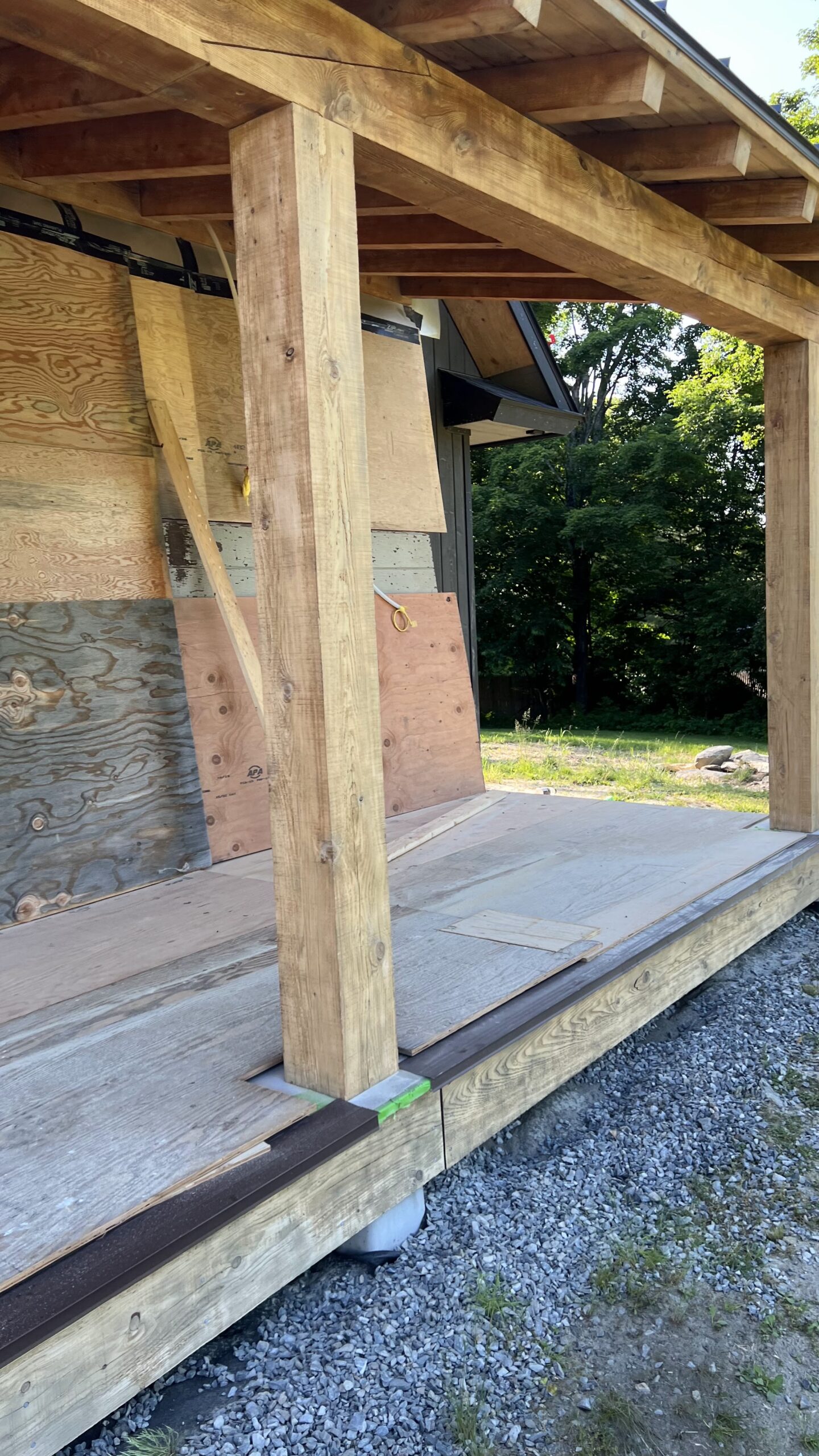 Porch Restoration – Sandblasting Dark Stain Off Wood Surface Wooden porch with dark stain sandblasted and restored by Green Mountain Mobile Sandblasting and Powder Coating
