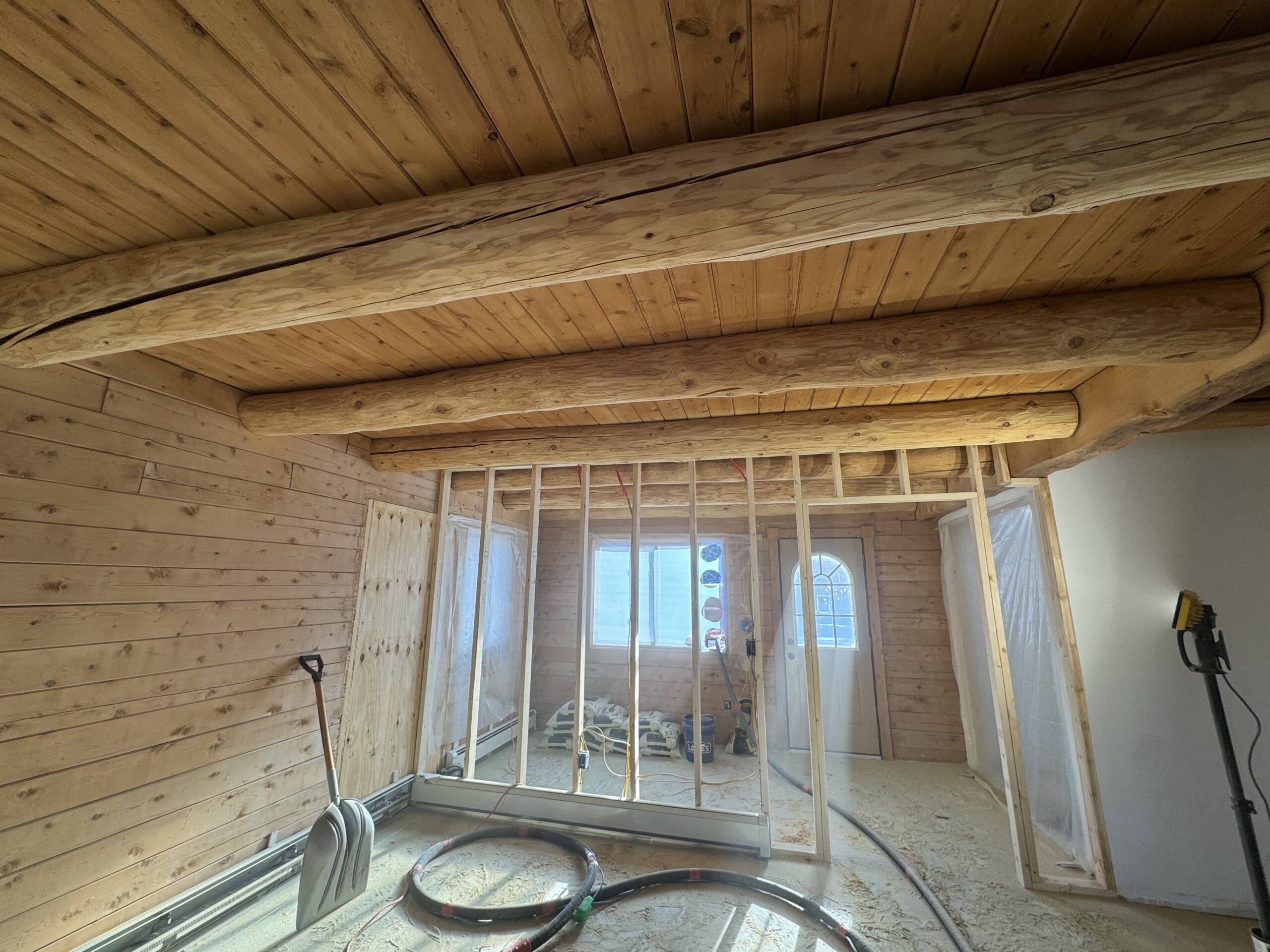 Ceiling wood beams sandblasted by Green Mountain Mobile Sandblasting and Powder Coating in Craftsbury Vermont with T&G areas left untouched