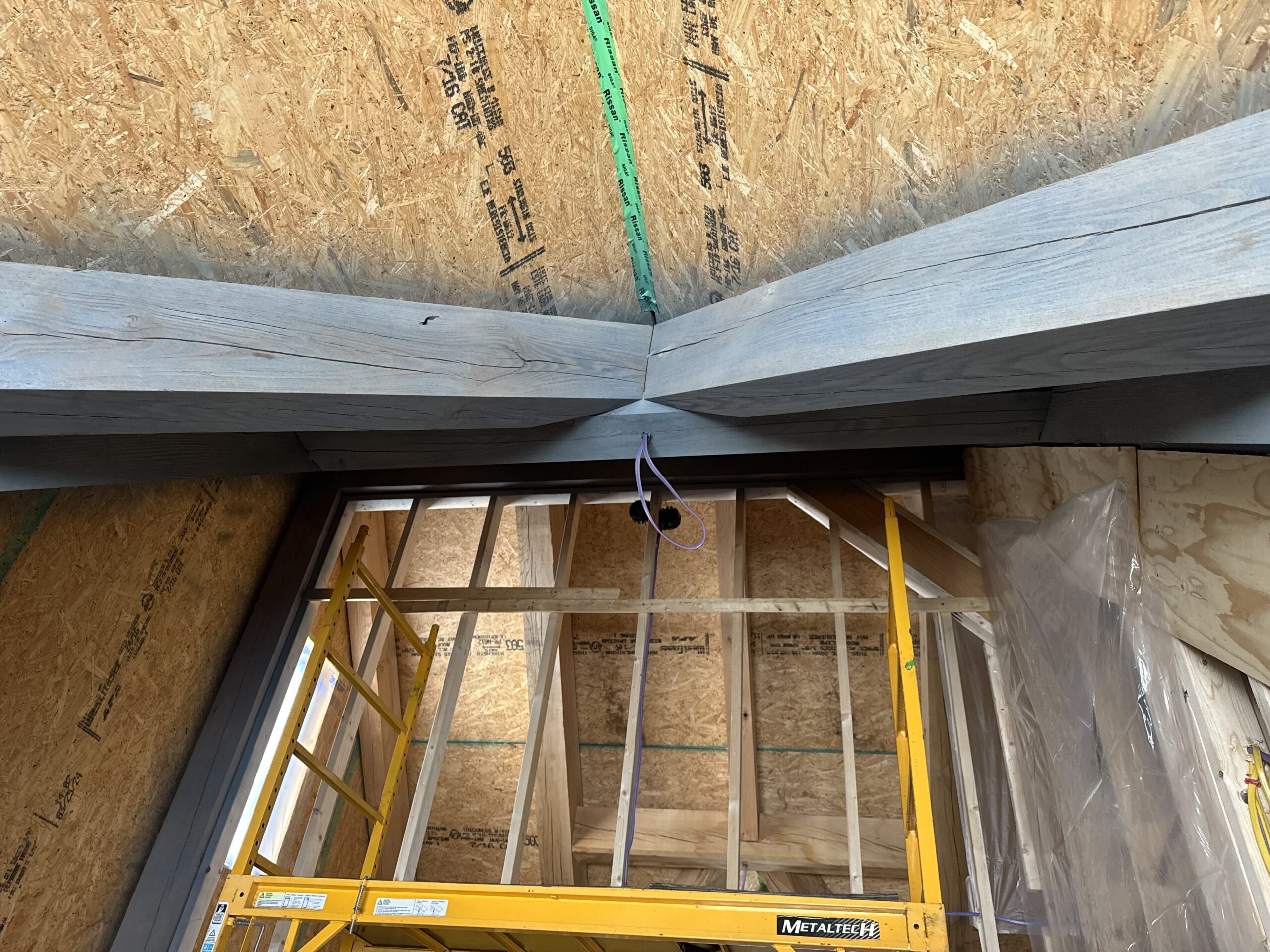 Interior Beam Restoration – Off-Grid Home in Elmore, VT Interior beams sandblasted by Green Mountain Mobile Sandblasting and Powder Coating in off-grid Elmore Vermont home to remove unwanted stain
