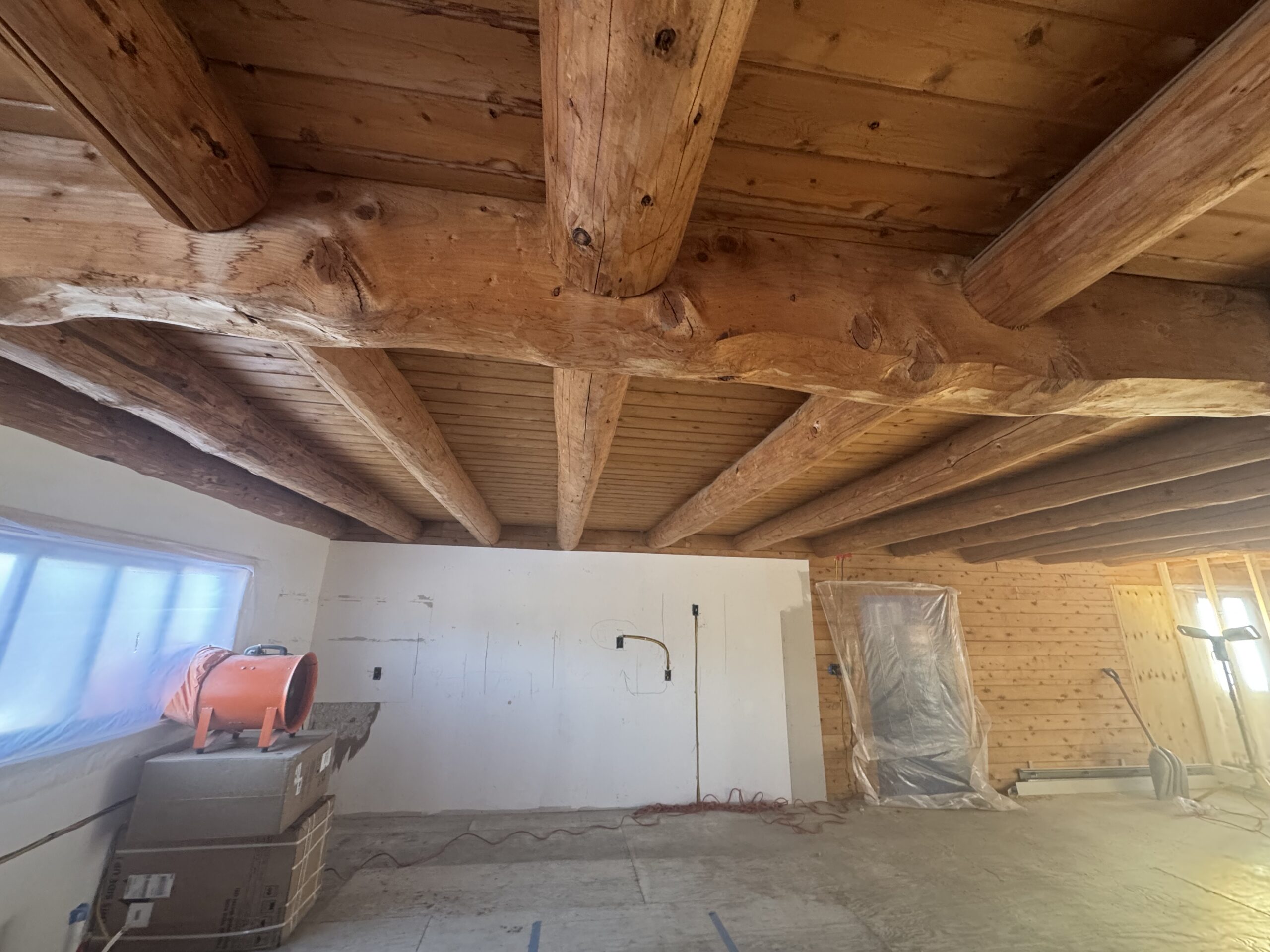 Ceiling Beam Sandblasting – Craftsbury VT Precision Woodwork Ceiling wood beams sandblasted by Green Mountain Mobile Sandblasting and Powder Coating in Craftsbury Vermont with T&G areas left untouched