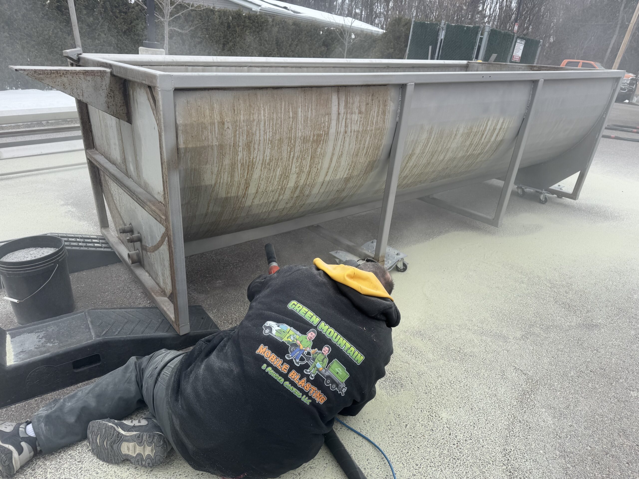 Sandblasting Rust Off a Stainless Steel Cleaning Tank Stainless steel cleaning tank with rust removed by sandblasting from Green Mountain Mobile Sandblasting and Powder Coating LLC