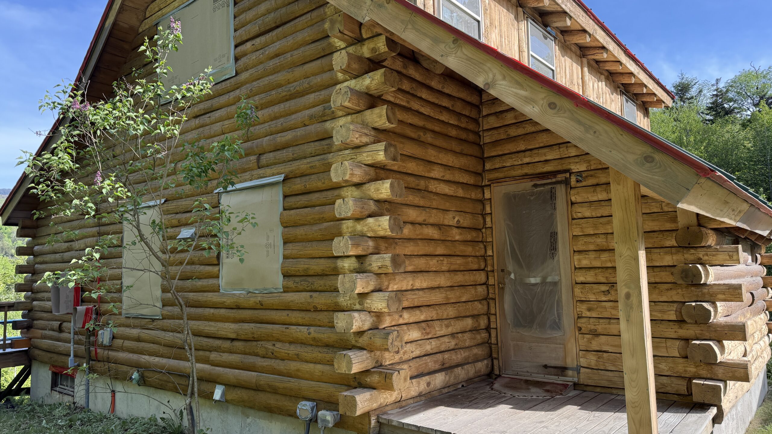 Northern Vermont Log Cabin – Before & After Sandblasting Log cabin sandblasting project in Northern Vermont showing before during and after restoration by Green Mountain Sandblasting and Powder Coating LLC