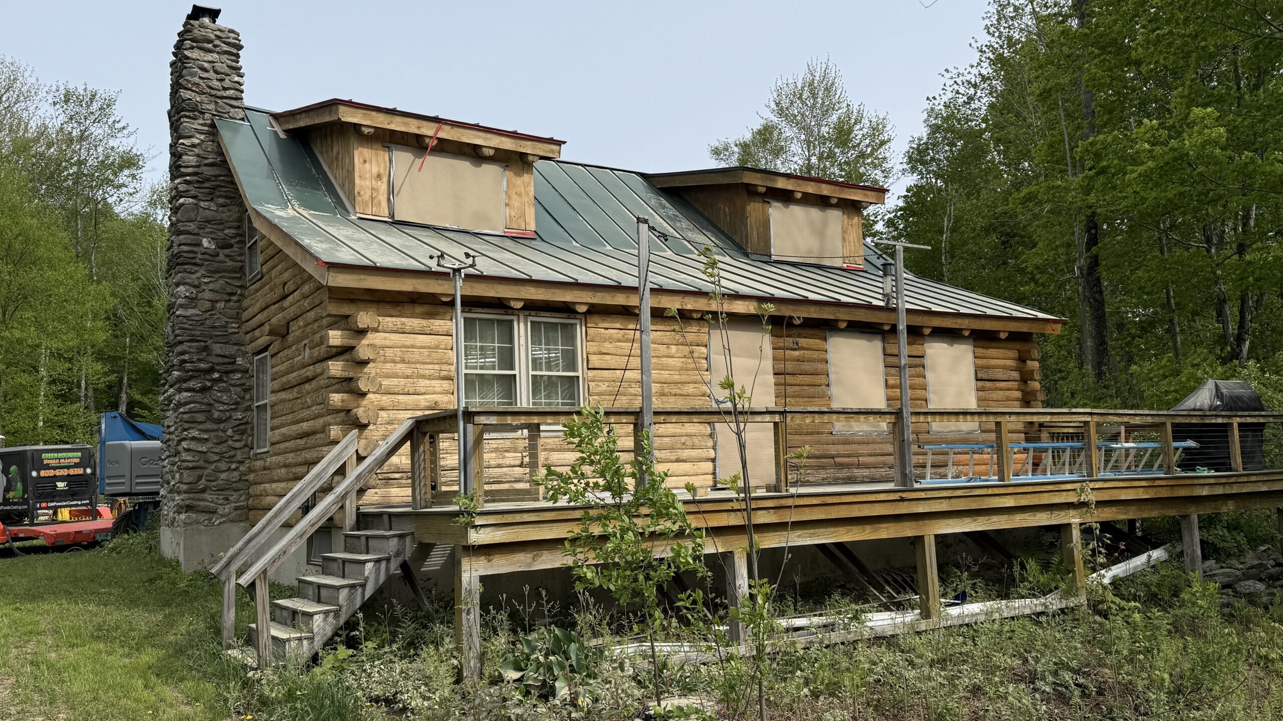 Northern Vermont Log Cabin – Before & After Sandblasting Log cabin sandblasting project in Northern Vermont showing before during and after restoration by Green Mountain Sandblasting and Powder Coating LLC