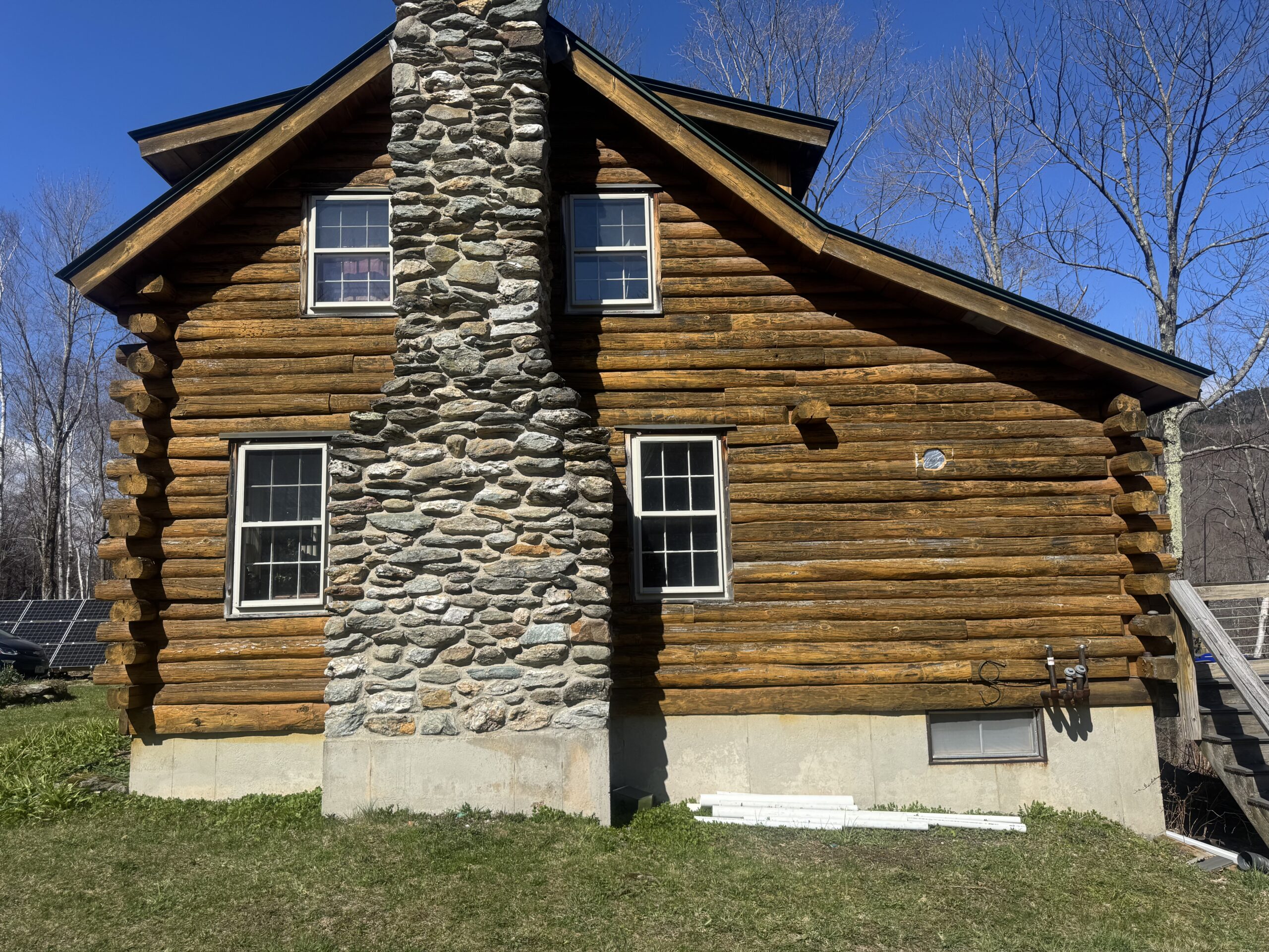 Northern Vermont Log Cabin – Before & After Sandblasting Log cabin sandblasting project in Northern Vermont showing before during and after restoration by Green Mountain Sandblasting and Powder Coating LLC