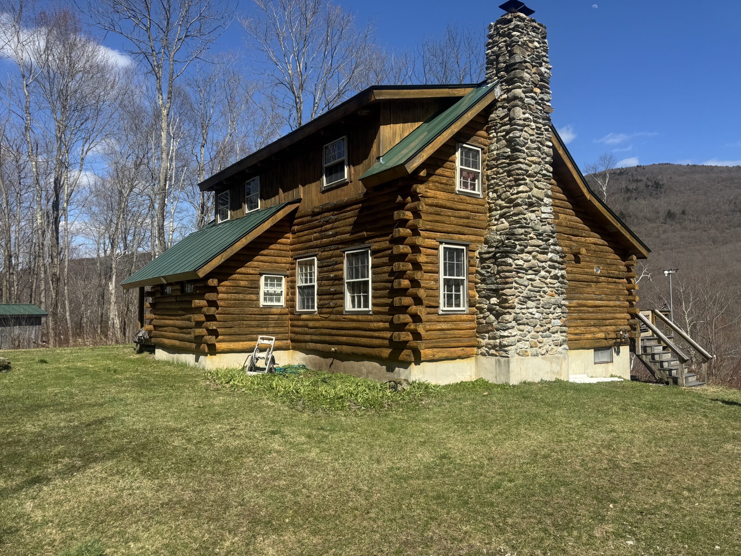 Northern Vermont Log Cabin – Before & After Sandblasting Log cabin sandblasting project in Northern Vermont showing before during and after restoration by Green Mountain Sandblasting and Powder Coating LLC