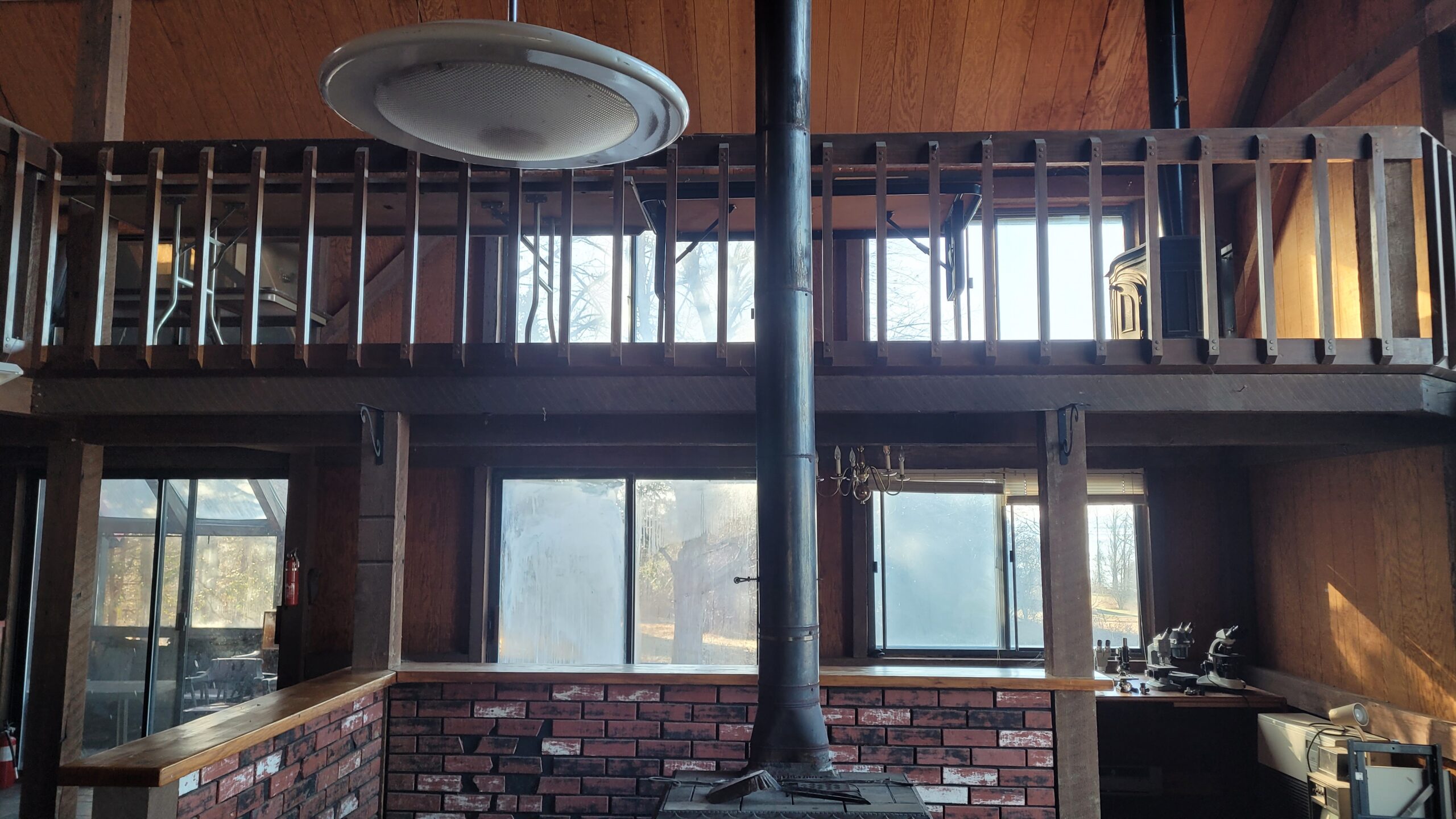 Lake Champlain Cabin – Interior Wood Sandblasting Restoration Cabin interior ceilings and wood beams sandblasted on Lake Champlain by Green Mountain Sandblasting and Powder Coating LLC showing before during and after restoration