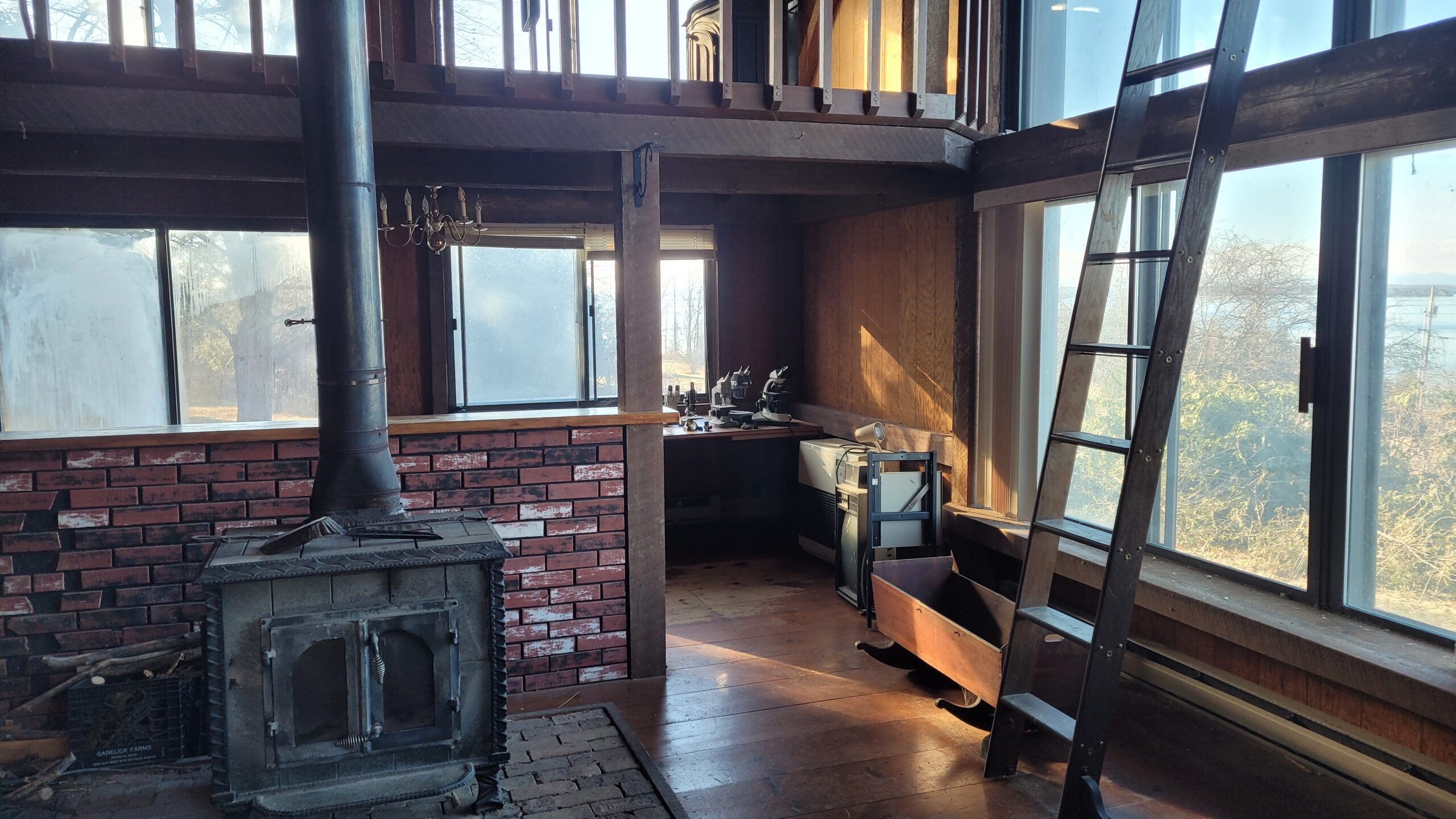Lake Champlain Cabin – Interior Wood Sandblasting Restoration Cabin interior ceilings and wood beams sandblasted on Lake Champlain by Green Mountain Sandblasting and Powder Coating LLC showing before during and after restoration