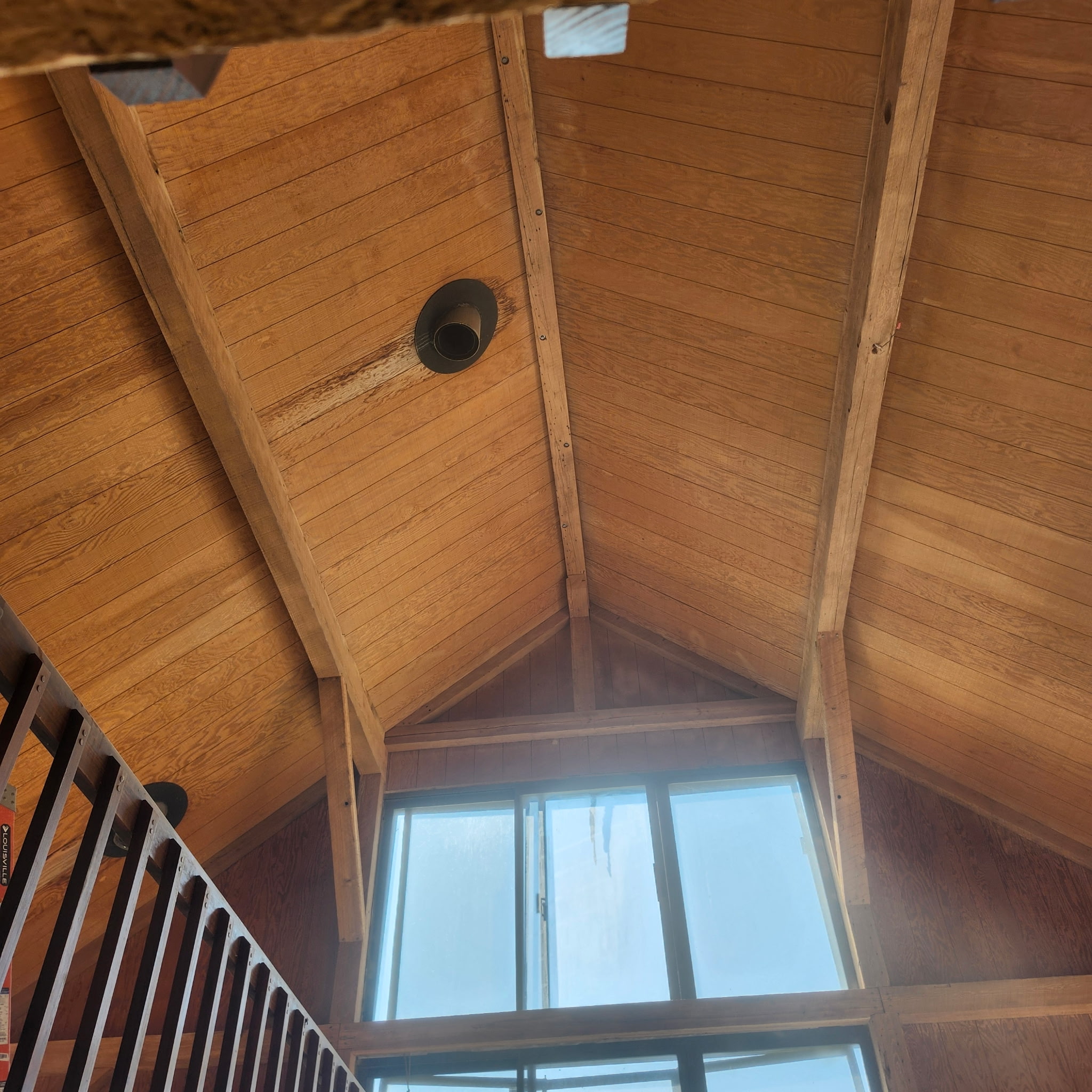 Lake Champlain Cabin – Interior Wood Sandblasting Restoration Cabin interior ceilings and wood beams sandblasted on Lake Champlain by Green Mountain Sandblasting and Powder Coating LLC showing before during and after restoration