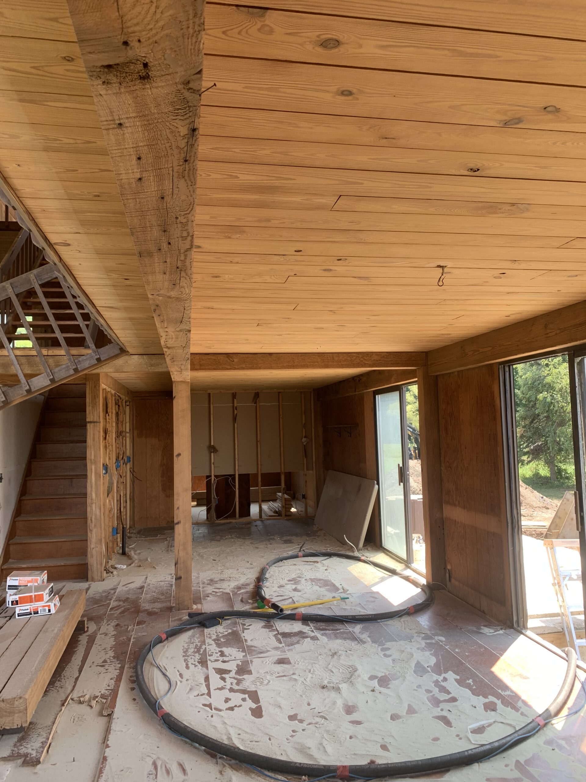 Lake Champlain Cabin – Interior Wood Sandblasting Restoration Cabin interior ceilings and wood beams sandblasted on Lake Champlain by Green Mountain Sandblasting and Powder Coating LLC showing before during and after restoration