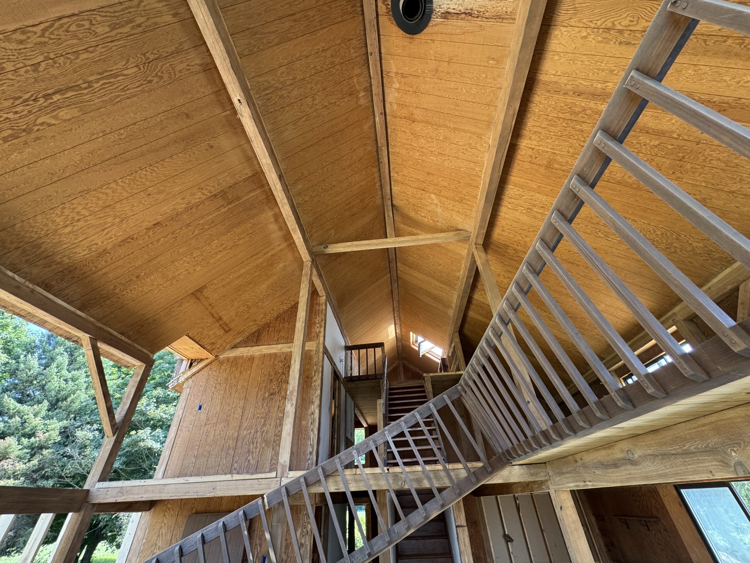 Lake Champlain Cabin – Interior Wood Sandblasting Restoration Cabin interior ceilings and wood beams sandblasted on Lake Champlain by Green Mountain Sandblasting and Powder Coating LLC showing before during and after restoration