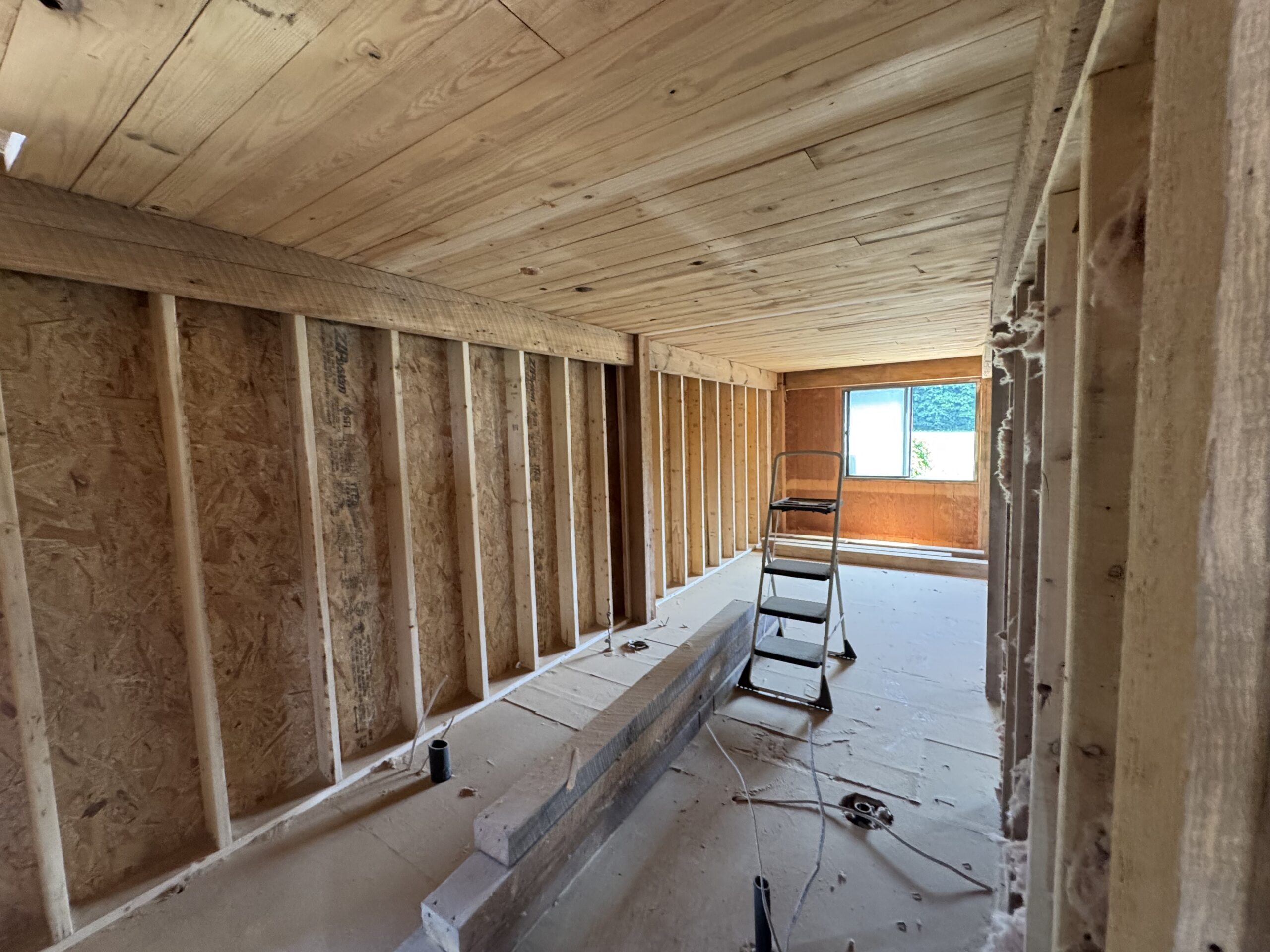 Lake Champlain Cabin – Interior Wood Sandblasting Restoration Cabin interior ceilings and wood beams sandblasted on Lake Champlain by Green Mountain Sandblasting and Powder Coating LLC showing before during and after restoration