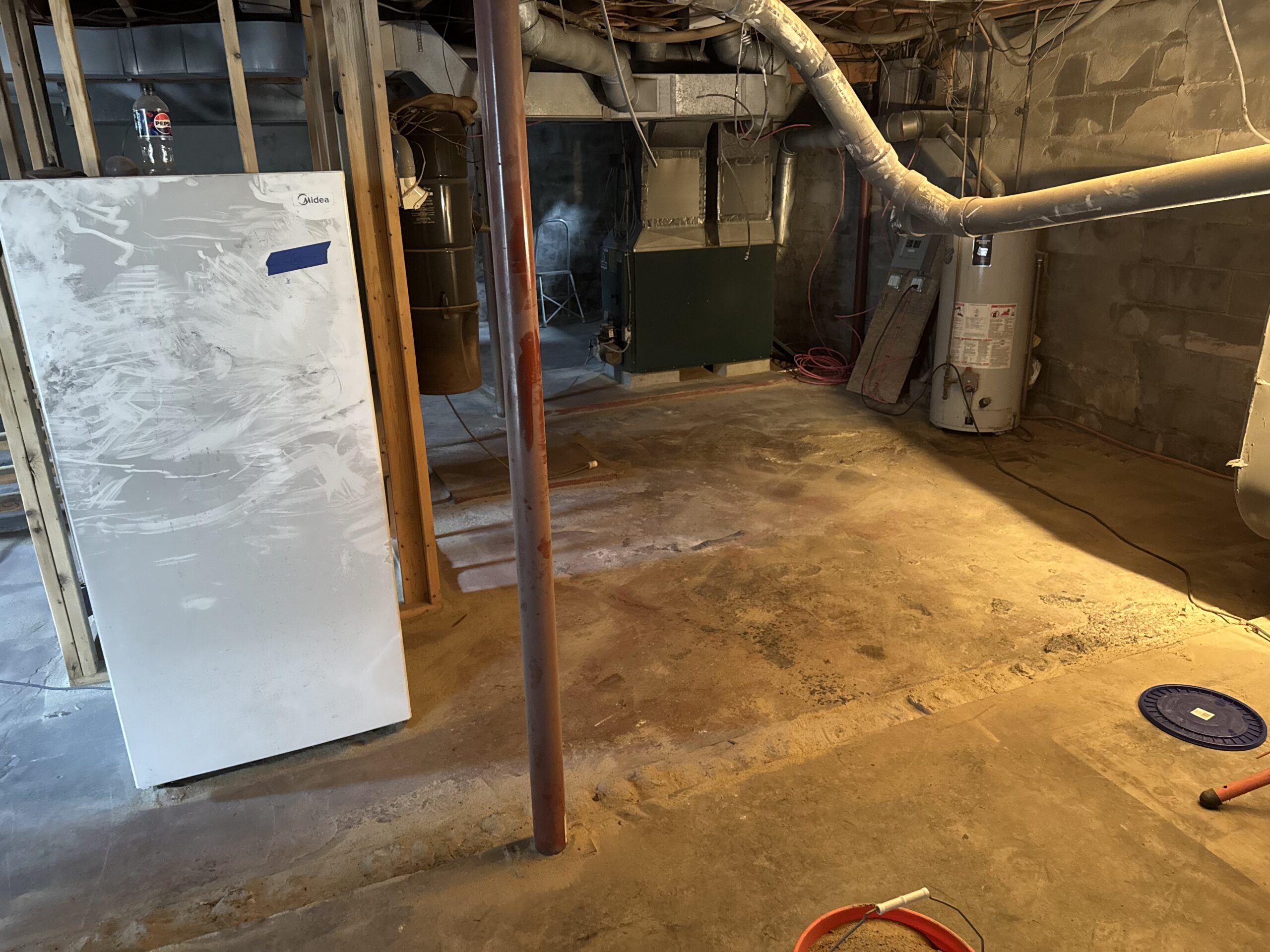 Fire Damage Sandblasting – Bristol, Vermont Before and after fire damage restoration in Bristol Vermont showing sandblasted wood floor joists and concrete basement walls