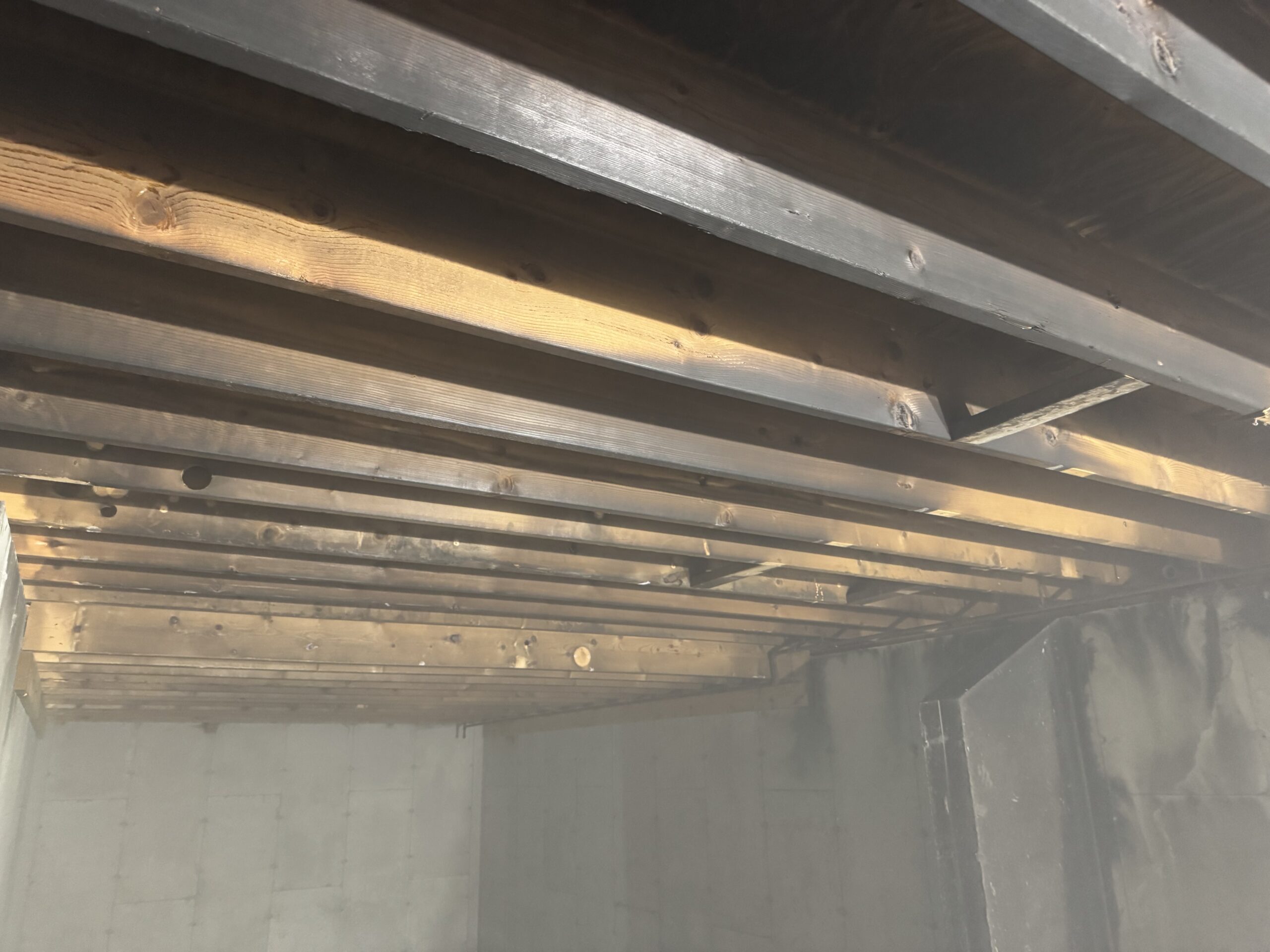 Fire Damage Restoration – Before & After Sandblasting Burned home before and after sandblasting restoration by Green Mountain Sandblasting and Powder Coating LLC for Phase Two Construction