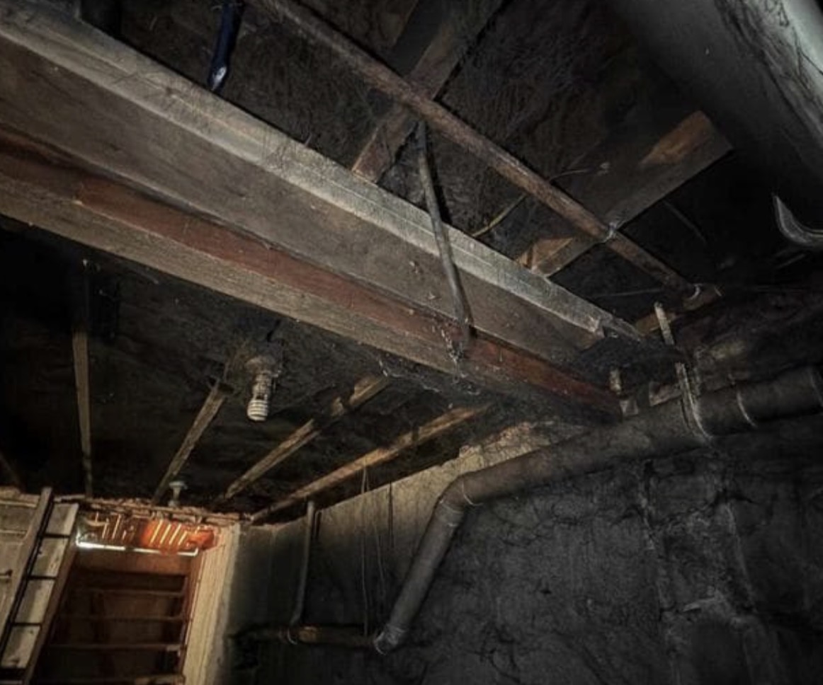 Fire Damage Sandblasting – Bristol, Vermont Before and after fire damage restoration in Bristol Vermont showing sandblasted wood floor joists and concrete basement walls