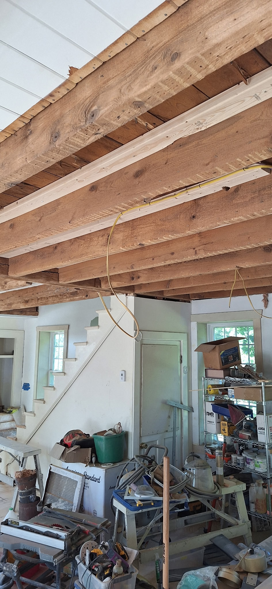 Interior Wood Beam Sandblasting – Isle La Motte, Vermont Interior ceiling beams in an Isle La Motte Vermont home selectively sandblasted to remove paint while leaving the surrounding wood untouched