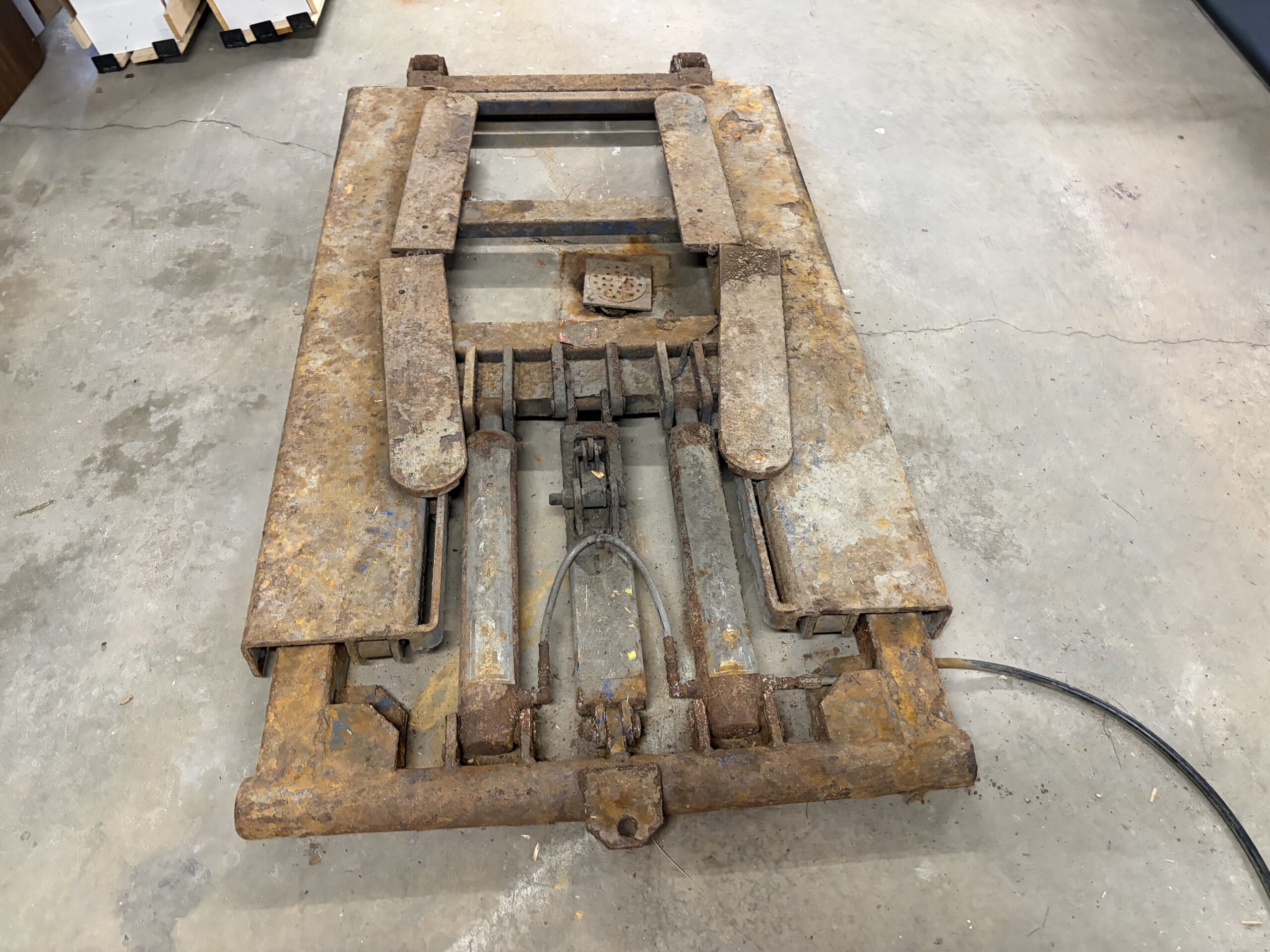 Old Lift Sandblasting & Restoration – Rutland, Vermont Before during and after restoration of a rusty old lift in Rutland Vermont showing the lift before sandblasting, after rust removal, and after custom painting