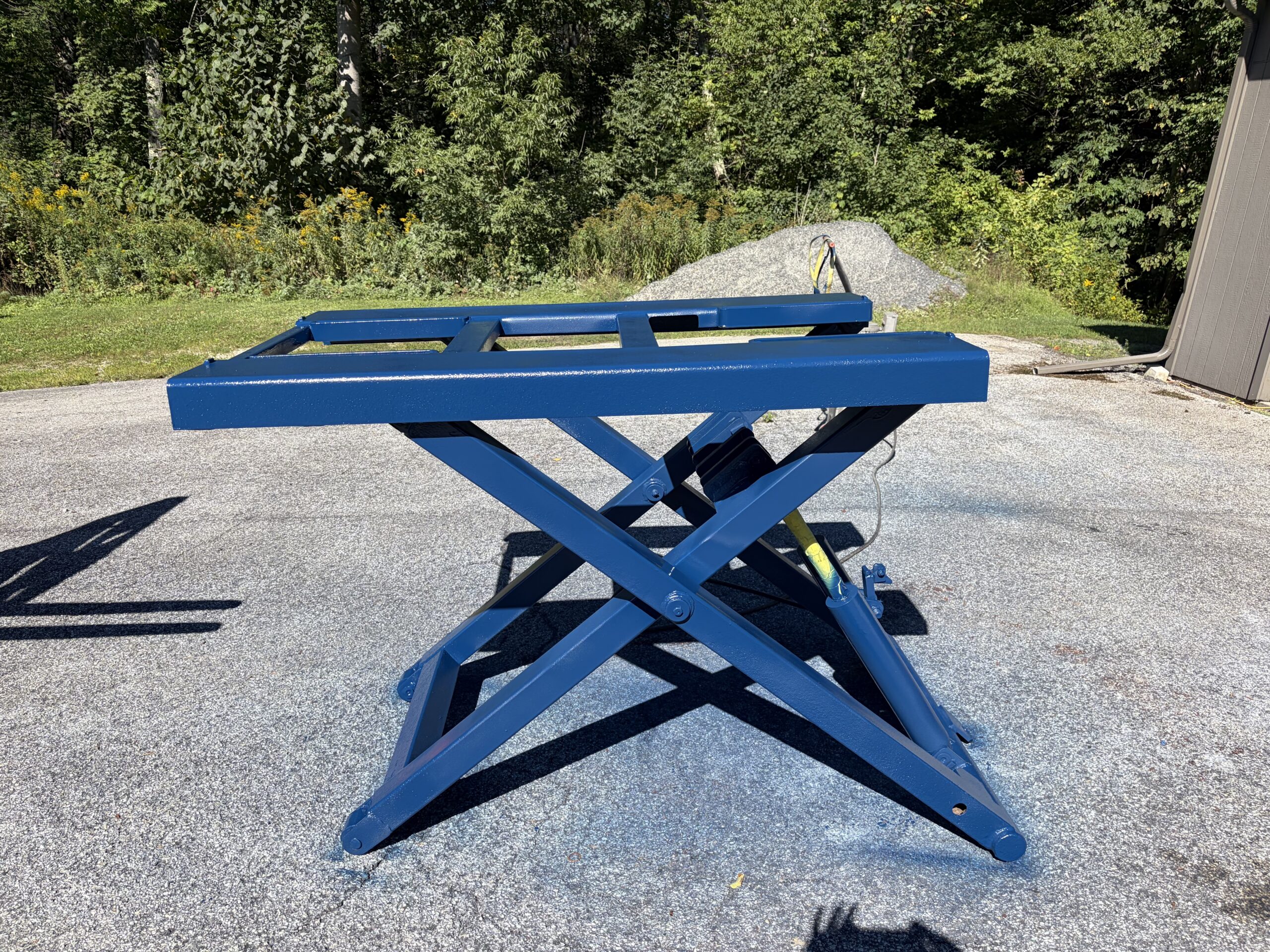 Old Lift Sandblasting & Restoration – Rutland, Vermont Before during and after restoration of a rusty old lift in Rutland Vermont showing the lift before sandblasting, after rust removal, and after custom painting