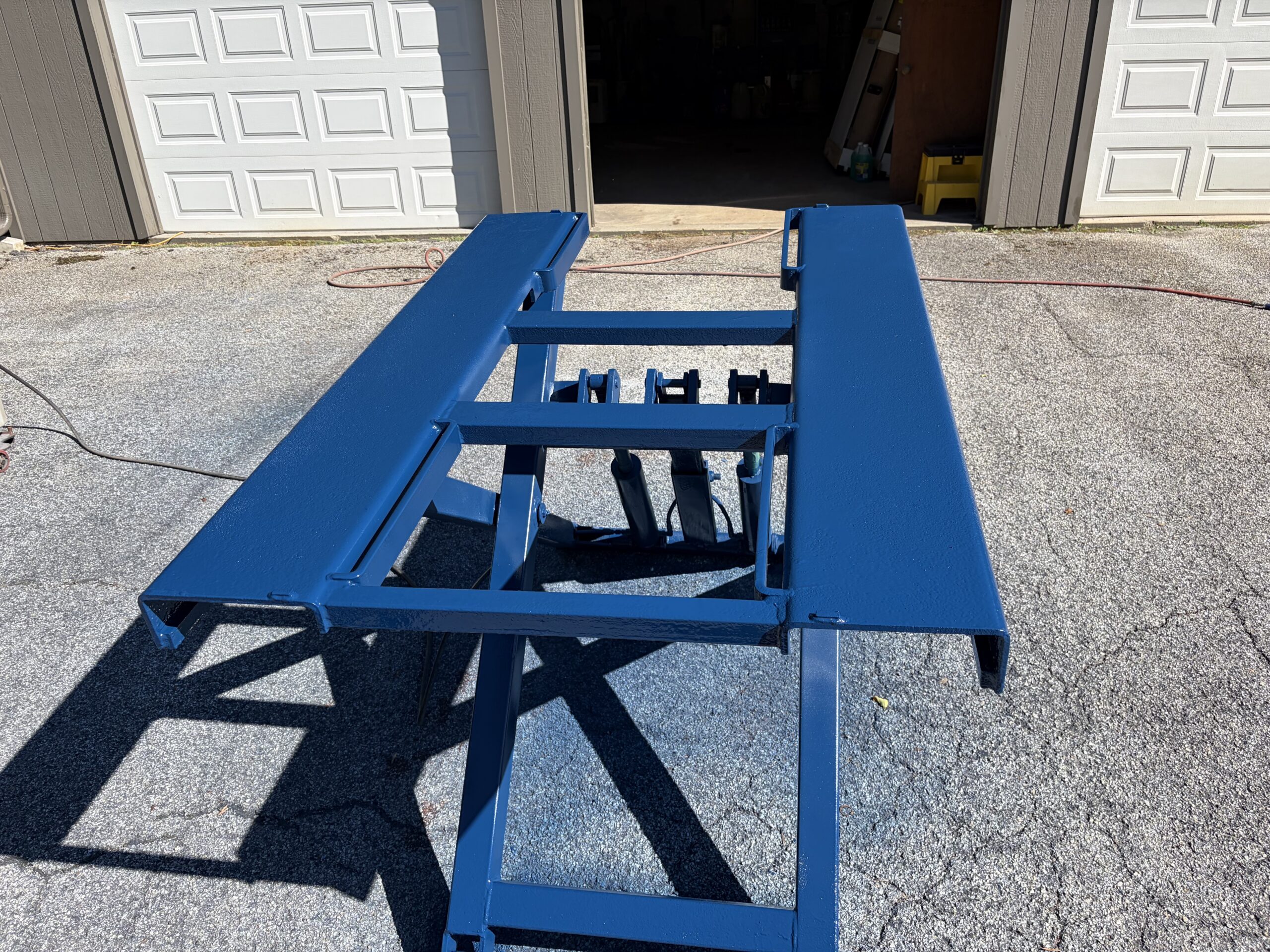 Old Lift Sandblasting & Restoration – Rutland, Vermont Before during and after restoration of a rusty old lift in Rutland Vermont showing the lift before sandblasting, after rust removal, and after custom painting