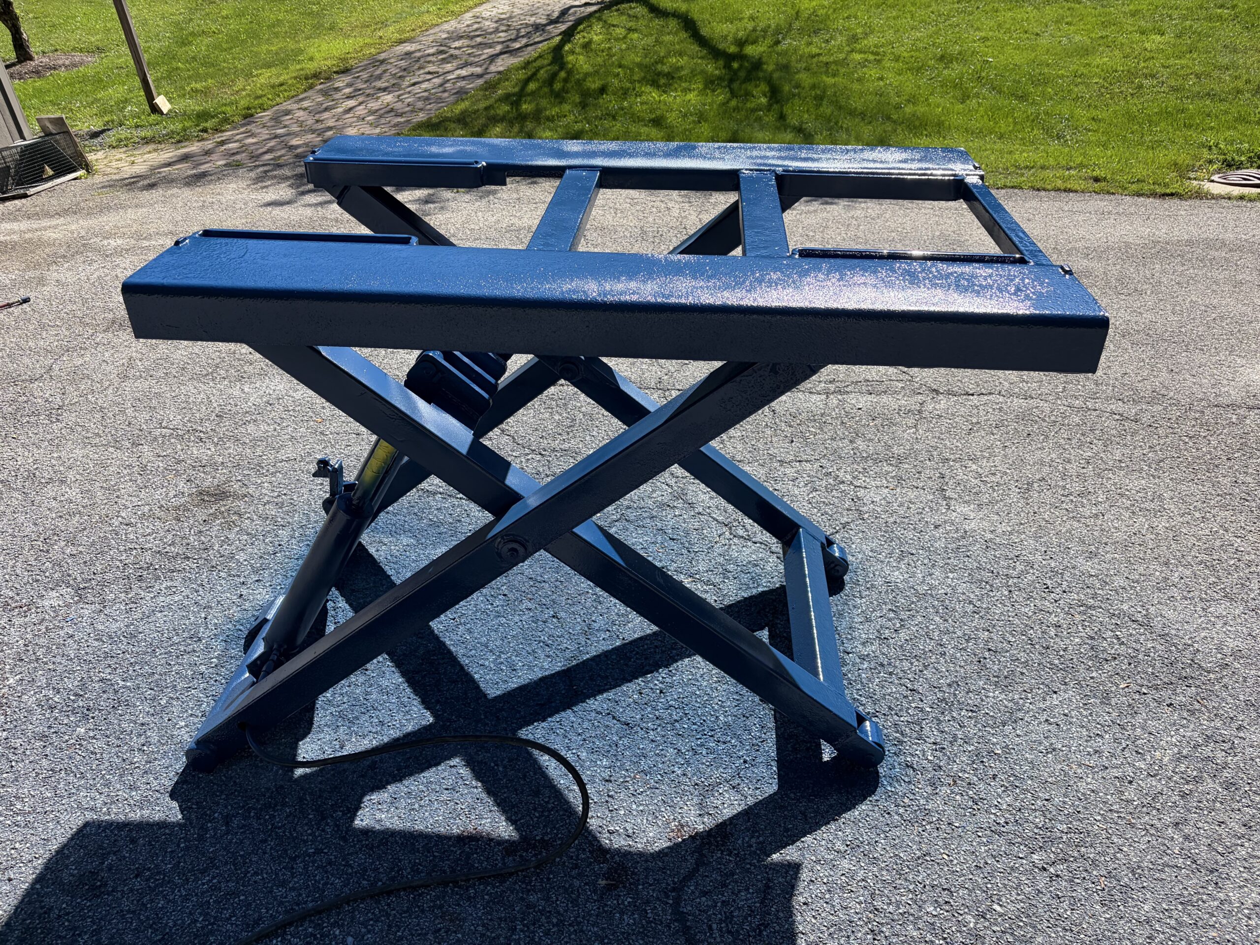 Old Lift Sandblasting & Restoration – Rutland, Vermont Before during and after restoration of a rusty old lift in Rutland Vermont showing the lift before sandblasting, after rust removal, and after custom painting
