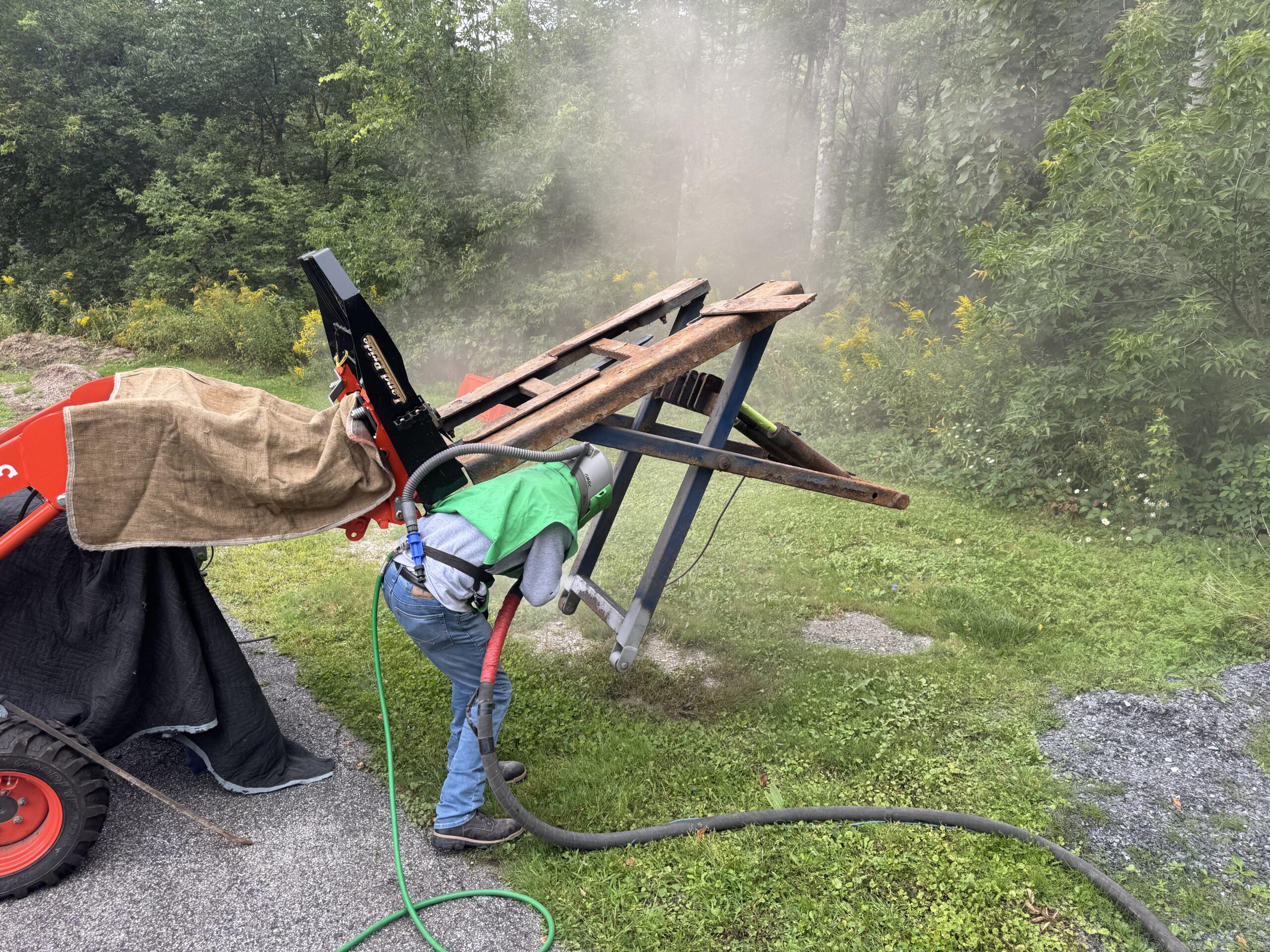 Old Lift Sandblasting & Restoration – Rutland, Vermont Before during and after restoration of a rusty old lift in Rutland Vermont showing the lift before sandblasting, after rust removal, and after custom painting