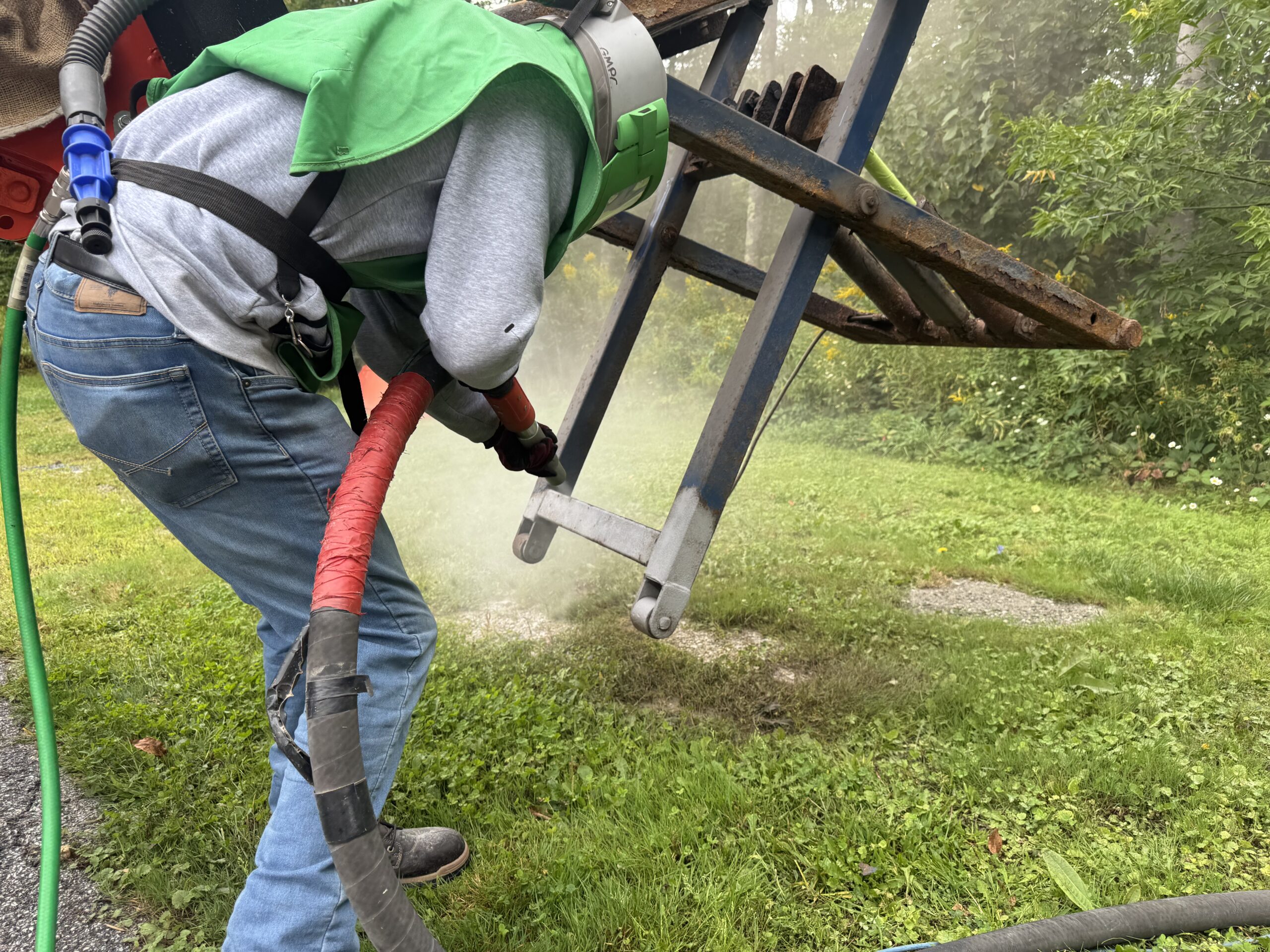 Old Lift Sandblasting & Restoration – Rutland, Vermont Before during and after restoration of a rusty old lift in Rutland Vermont showing the lift before sandblasting, after rust removal, and after custom painting