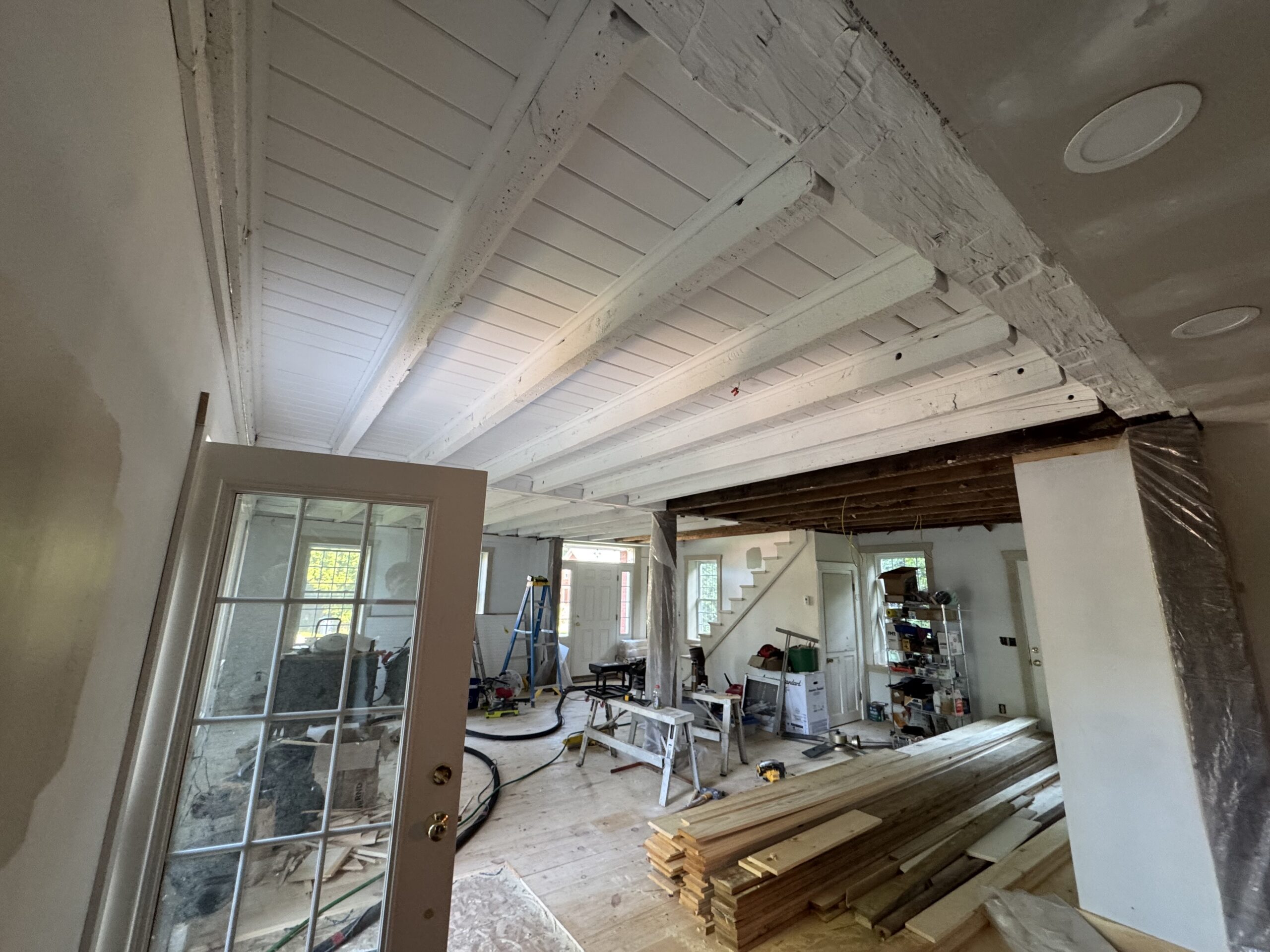 Interior Wood Beam Sandblasting – Isle La Motte, Vermont Interior ceiling beams in an Isle La Motte Vermont home selectively sandblasted to remove paint while leaving the surrounding wood untouched