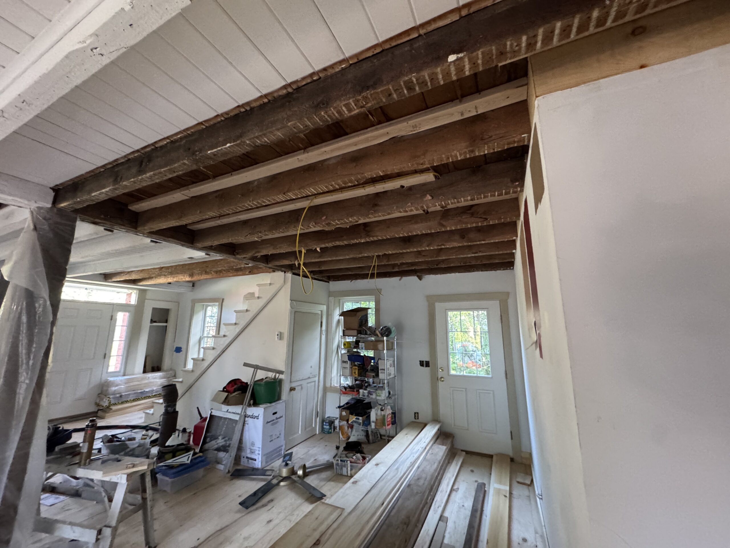 Interior Wood Beam Sandblasting – Isle La Motte, Vermont Interior ceiling beams in an Isle La Motte Vermont home selectively sandblasted to remove paint while leaving the surrounding wood untouched