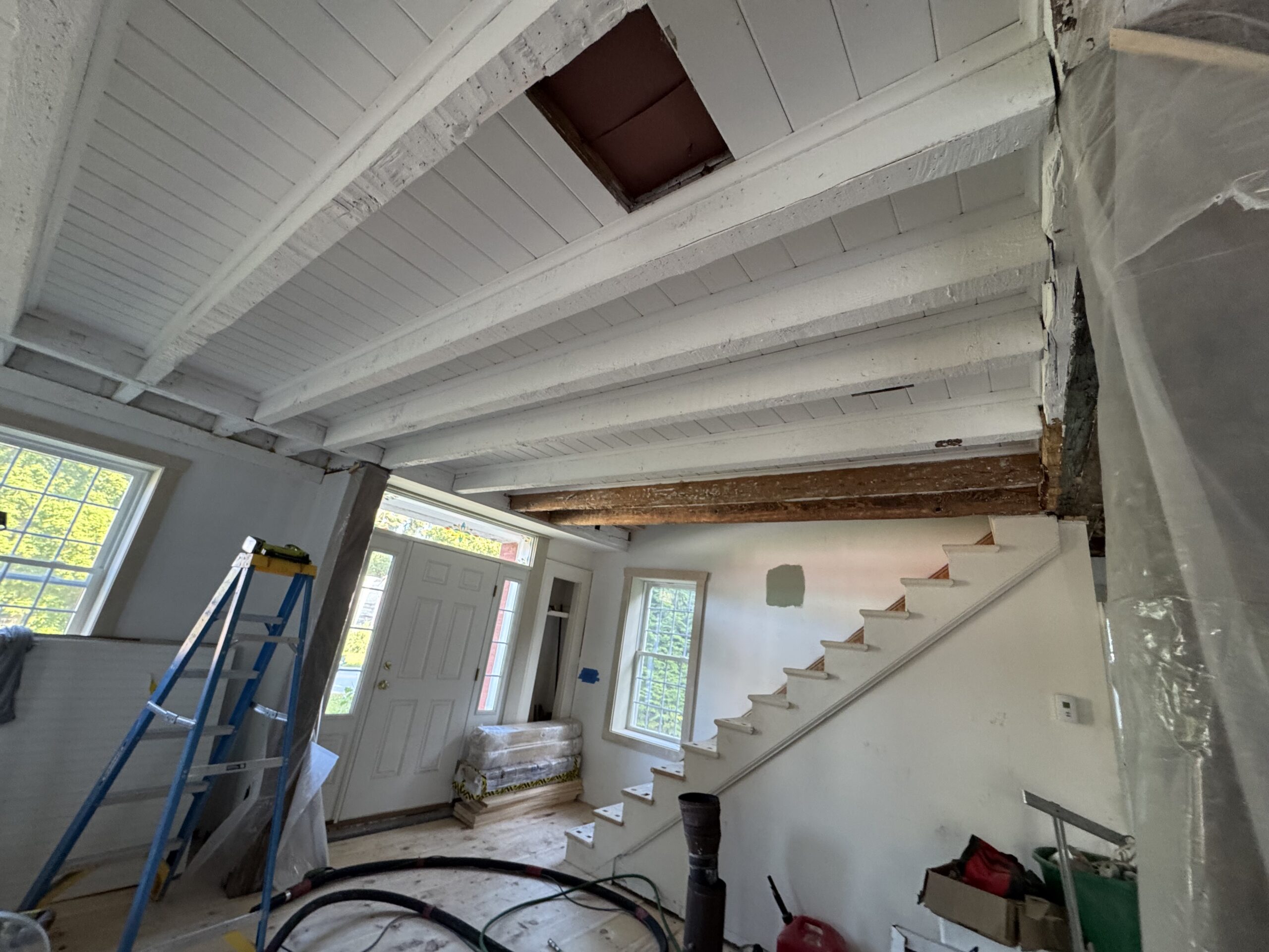 Interior Wood Beam Sandblasting – Isle La Motte, Vermont Interior ceiling beams in an Isle La Motte Vermont home selectively sandblasted to remove paint while leaving the surrounding wood untouched