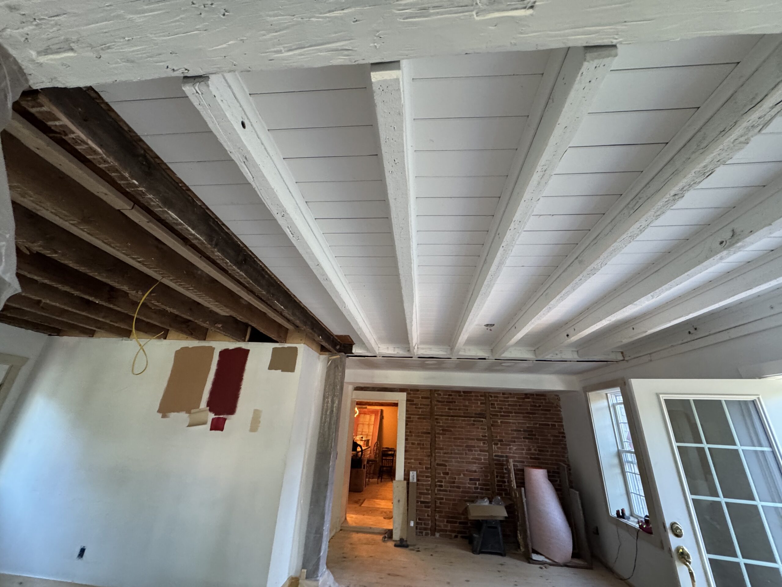 Interior Wood Beam Sandblasting – Isle La Motte, Vermont Interior ceiling beams in an Isle La Motte Vermont home selectively sandblasted to remove paint while leaving the surrounding wood untouched