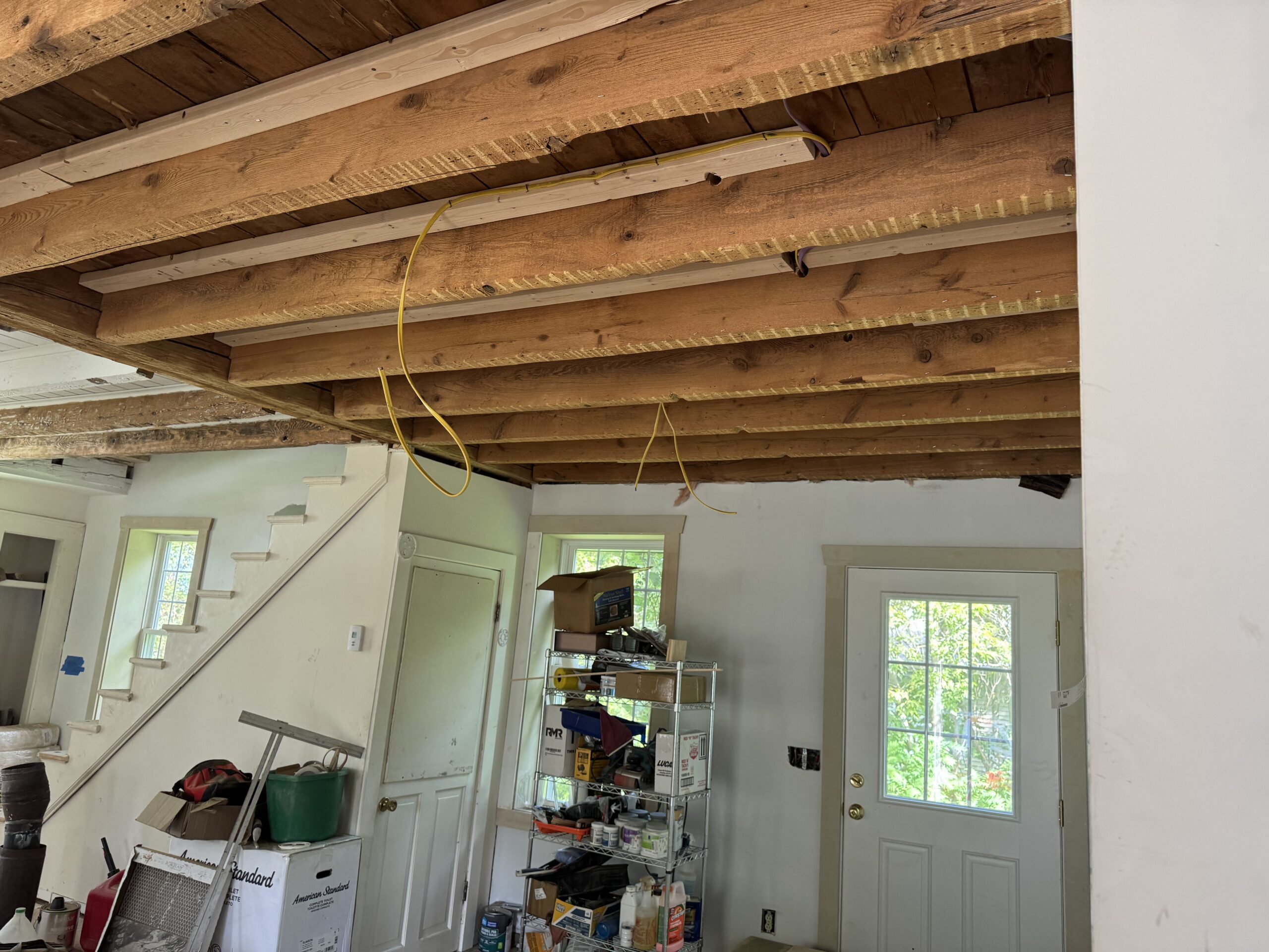 Interior Wood Beam Sandblasting – Isle La Motte, Vermont Interior ceiling beams in an Isle La Motte Vermont home selectively sandblasted to remove paint while leaving the surrounding wood untouched