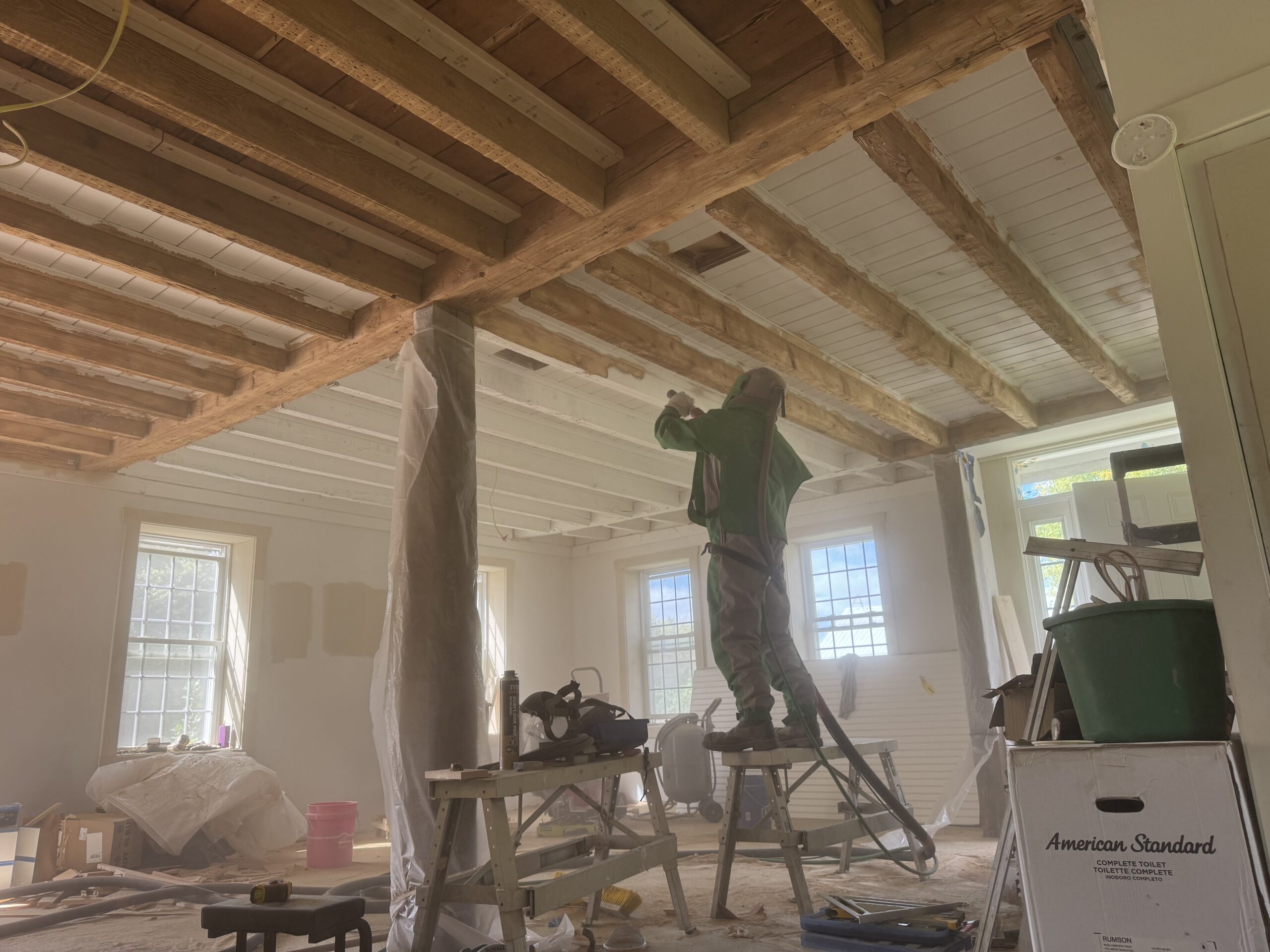 Interior Wood Beam Sandblasting – Isle La Motte, Vermont Interior ceiling beams in an Isle La Motte Vermont home selectively sandblasted to remove paint while leaving the surrounding wood untouched