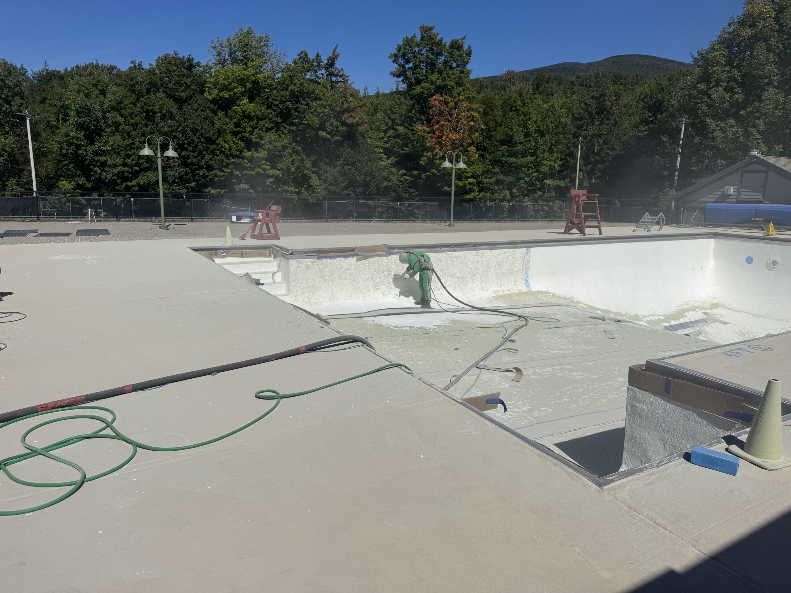 Swimming Pool Paint Etching – Smugglers’ Notch Resort, Jeffersonville, Vermont Swimming pool at Smugglers’ Notch Resort in Jeffersonville Vermont professionally sandblasted to etch the existing painted surface for a new coating